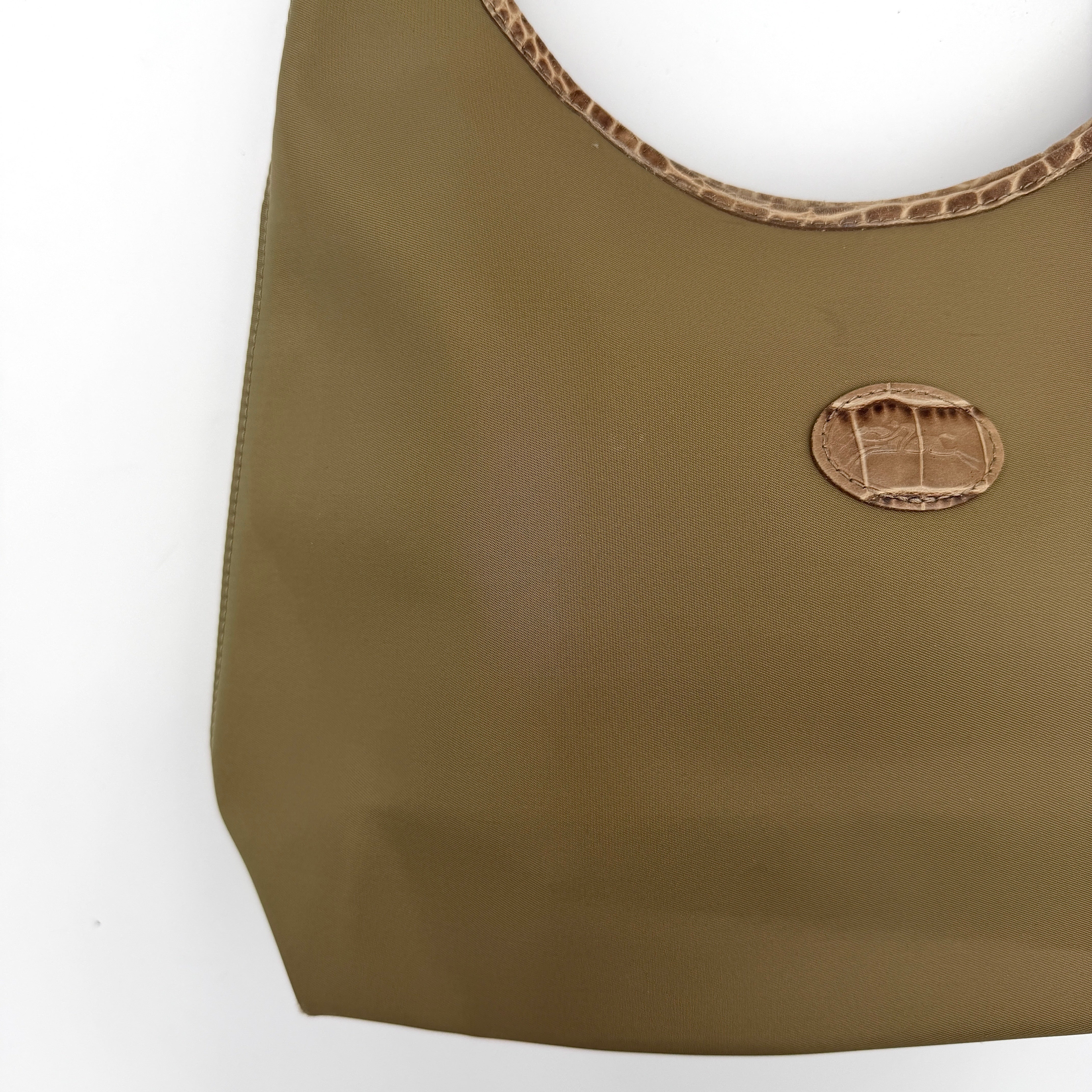 Longchamp Sac Porte Epaule hobo shoulder bag in brown nylon with lizard-embossed leather trim and a wide single handle.