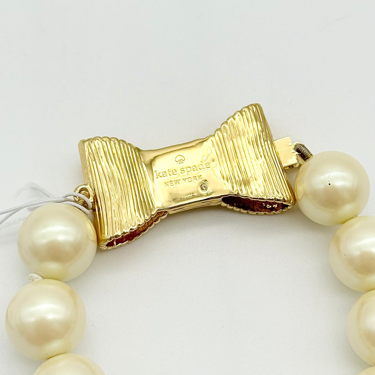 Kate Spade All Wrapped Up Pearl Gold Bow Bracelet
