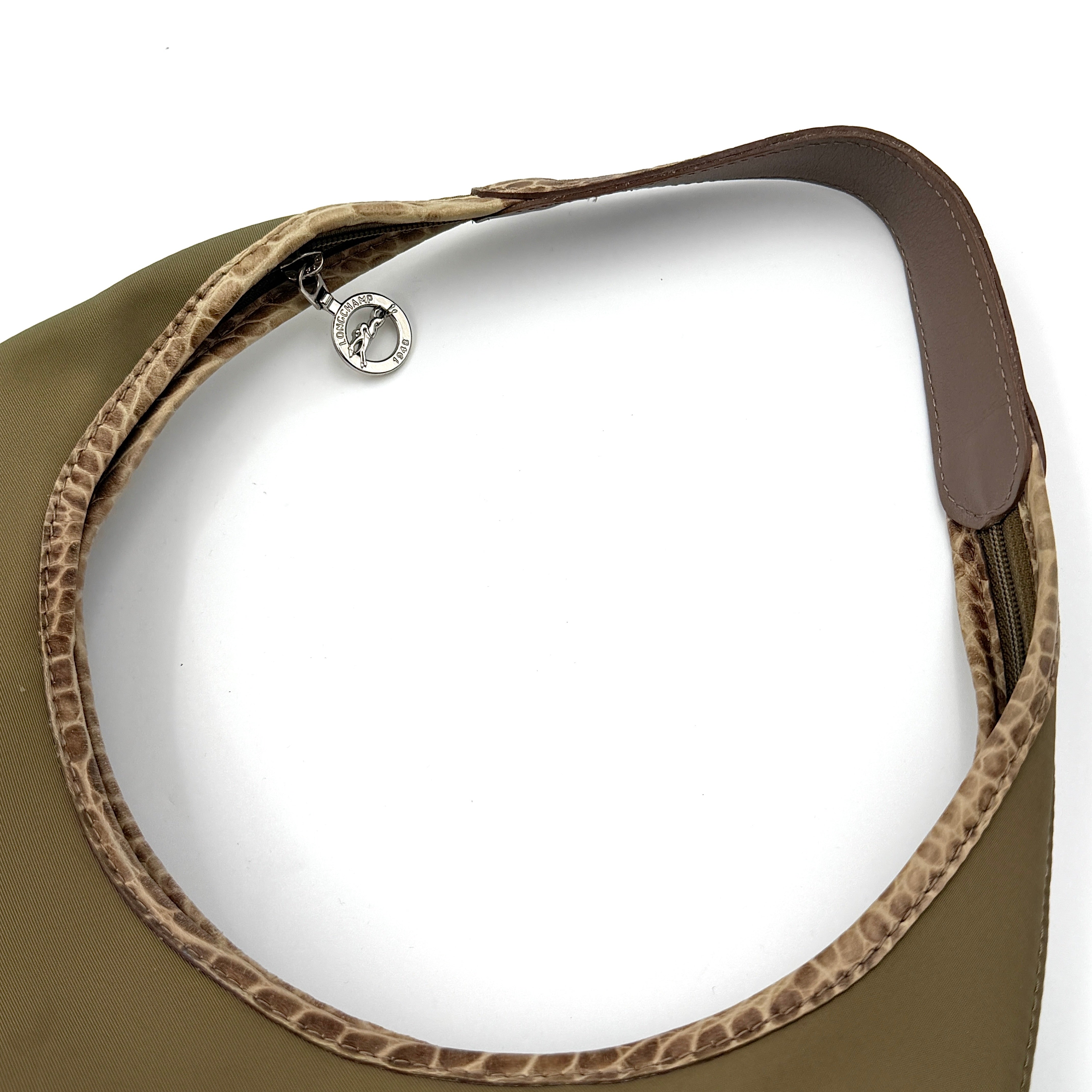 Longchamp Sac Porte Epaule hobo shoulder bag in brown nylon with lizard-embossed leather trim and a wide single handle.