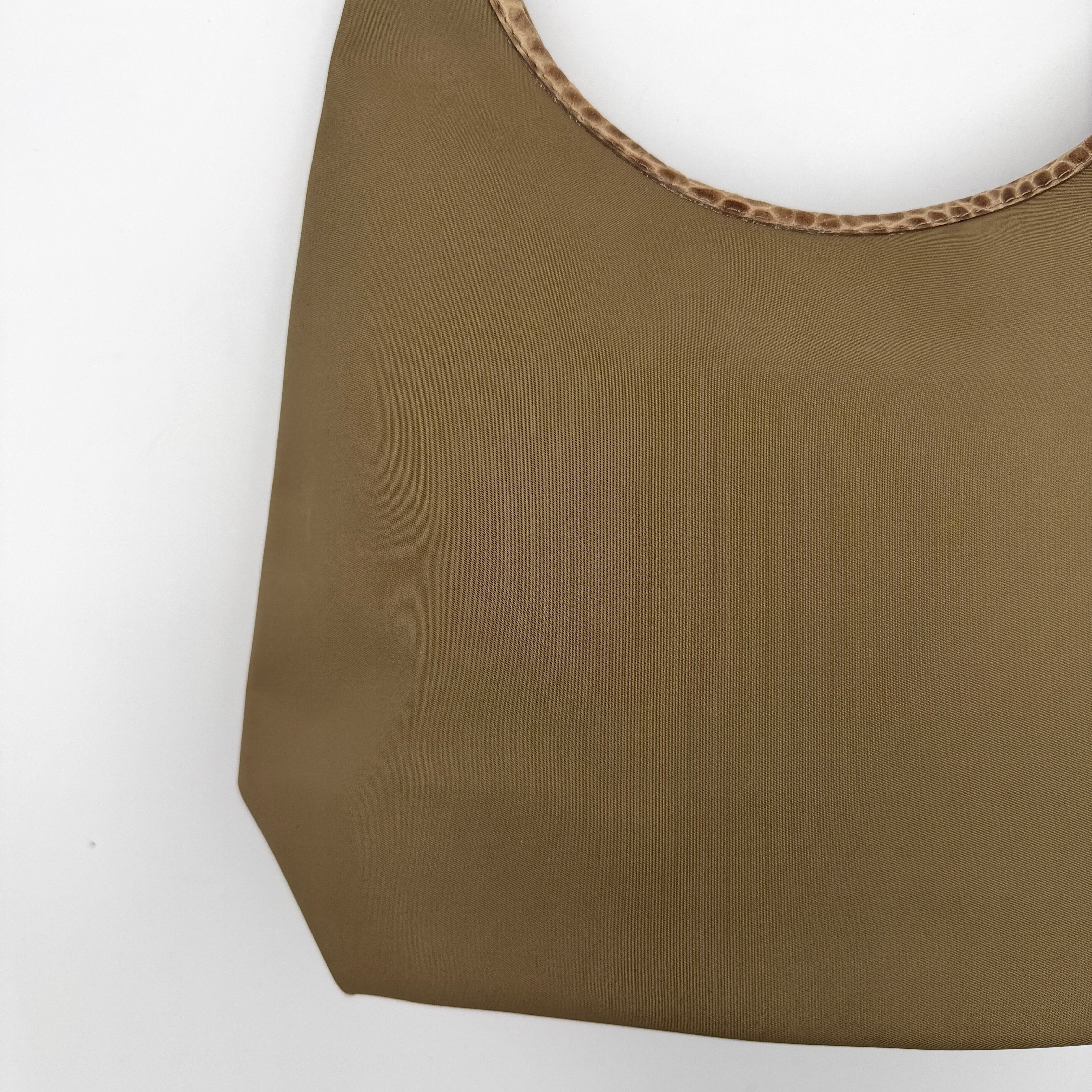 Longchamp Sac Porte Epaule hobo shoulder bag in brown nylon with lizard-embossed leather trim and a wide single handle.
