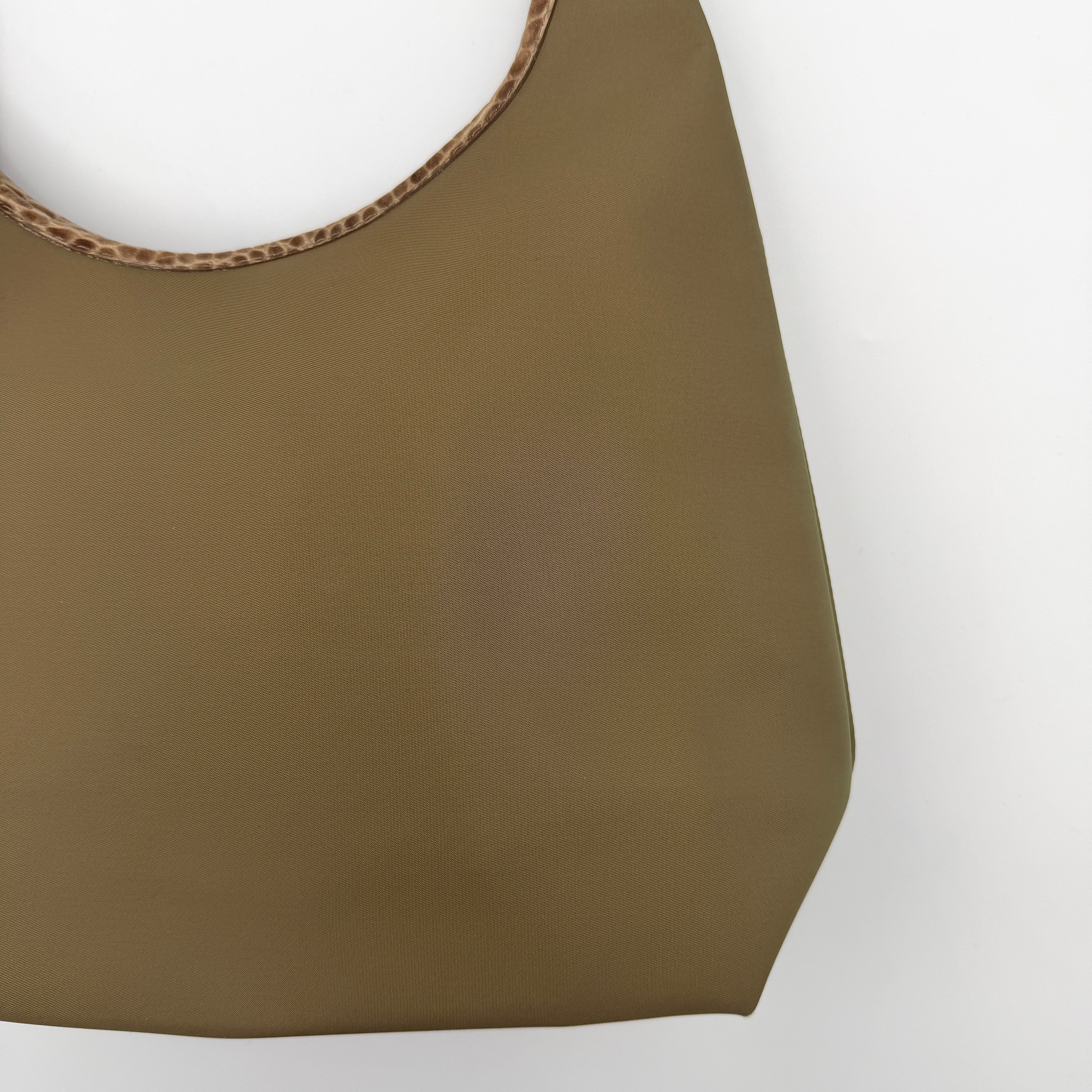 Longchamp Sac Porte Epaule hobo shoulder bag in brown nylon with lizard-embossed leather trim and a wide single handle.