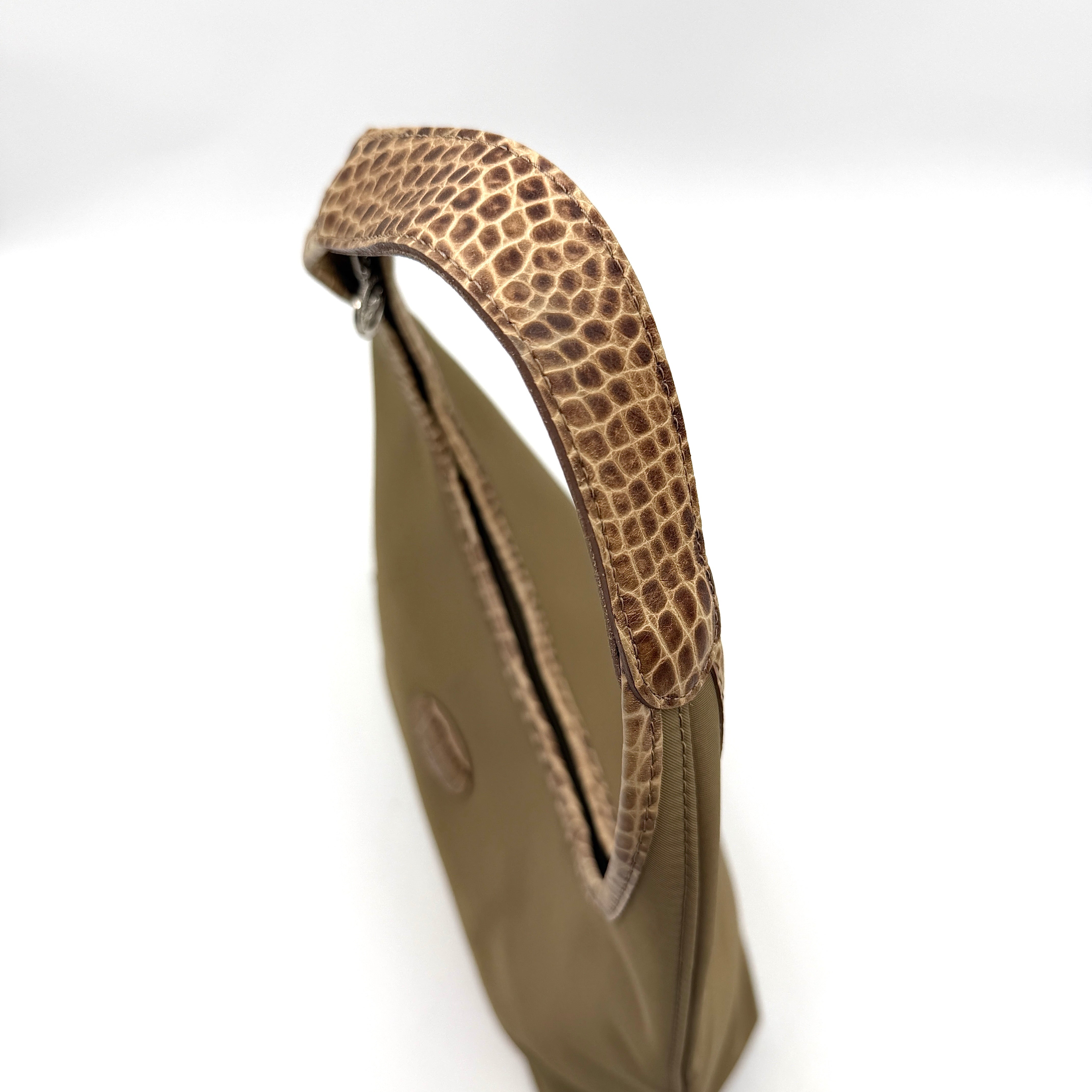 Longchamp Sac Porte Epaule hobo shoulder bag in brown nylon with lizard-embossed leather trim and a wide single handle.