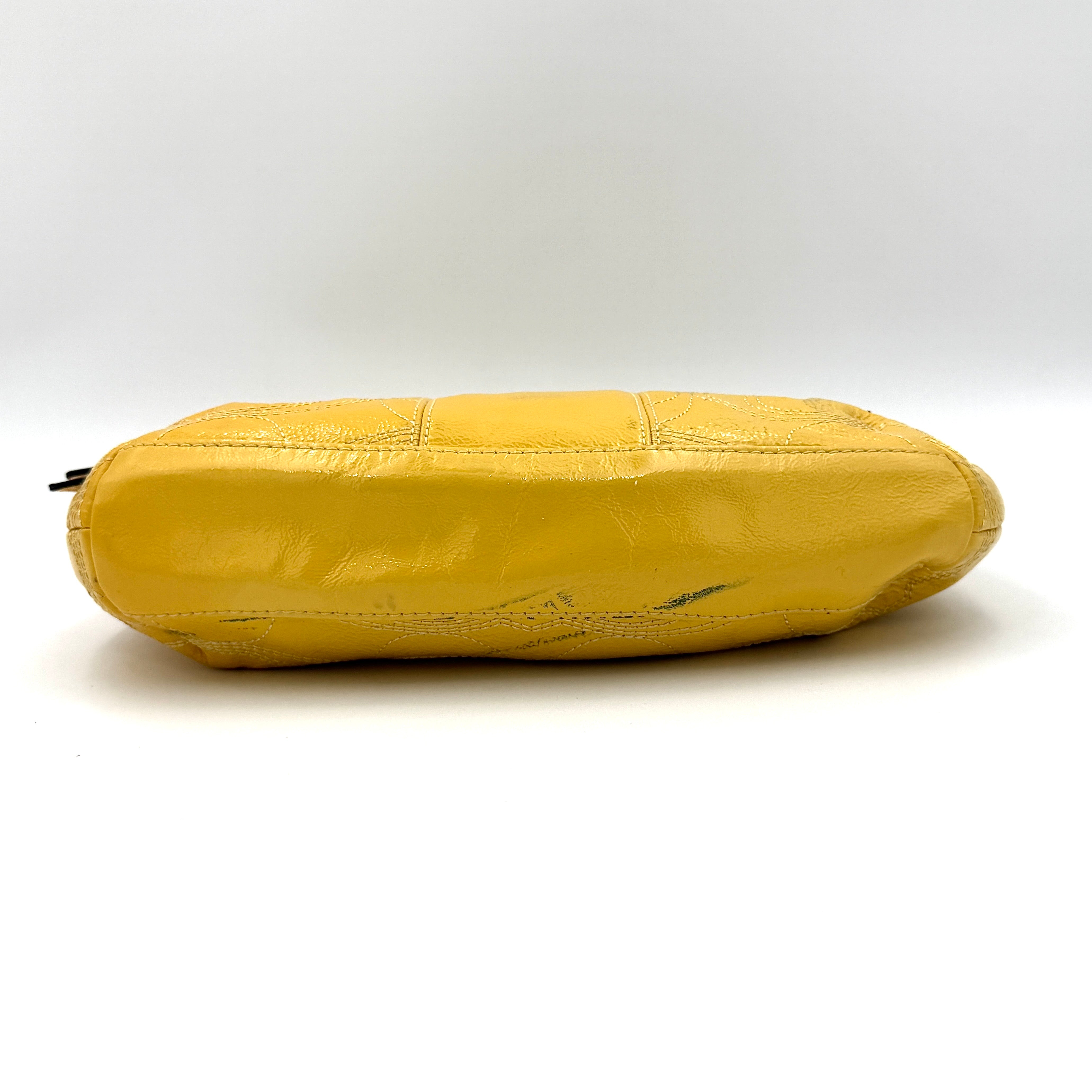 Coach 2Way Signature Stripe Patent Shoulder Bag in patent sunflower yellow leather with signature stitching and detachable strap displayed.