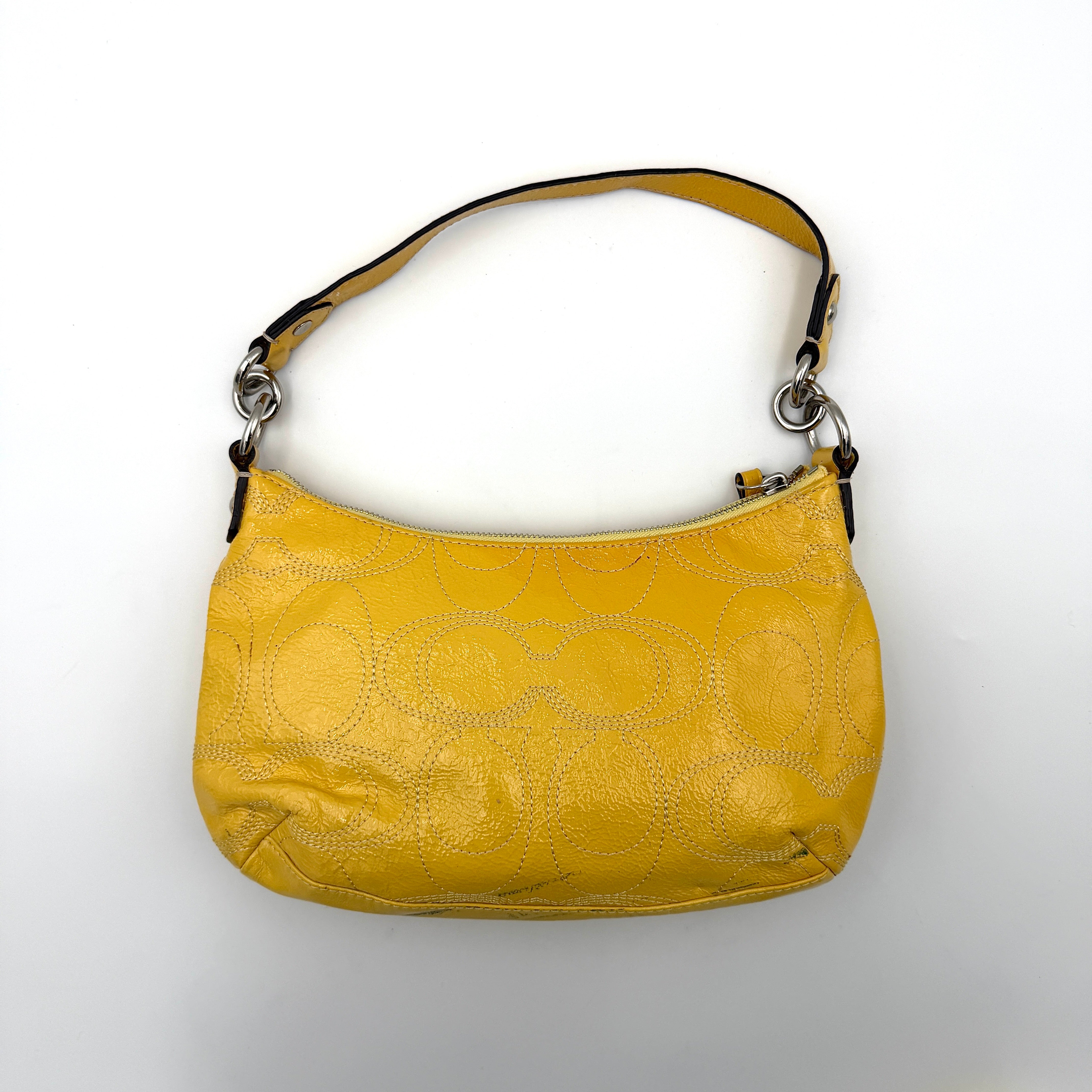 Coach 2Way Signature Stripe Patent Shoulder Bag in patent sunflower yellow leather with signature stitching and detachable strap displayed.