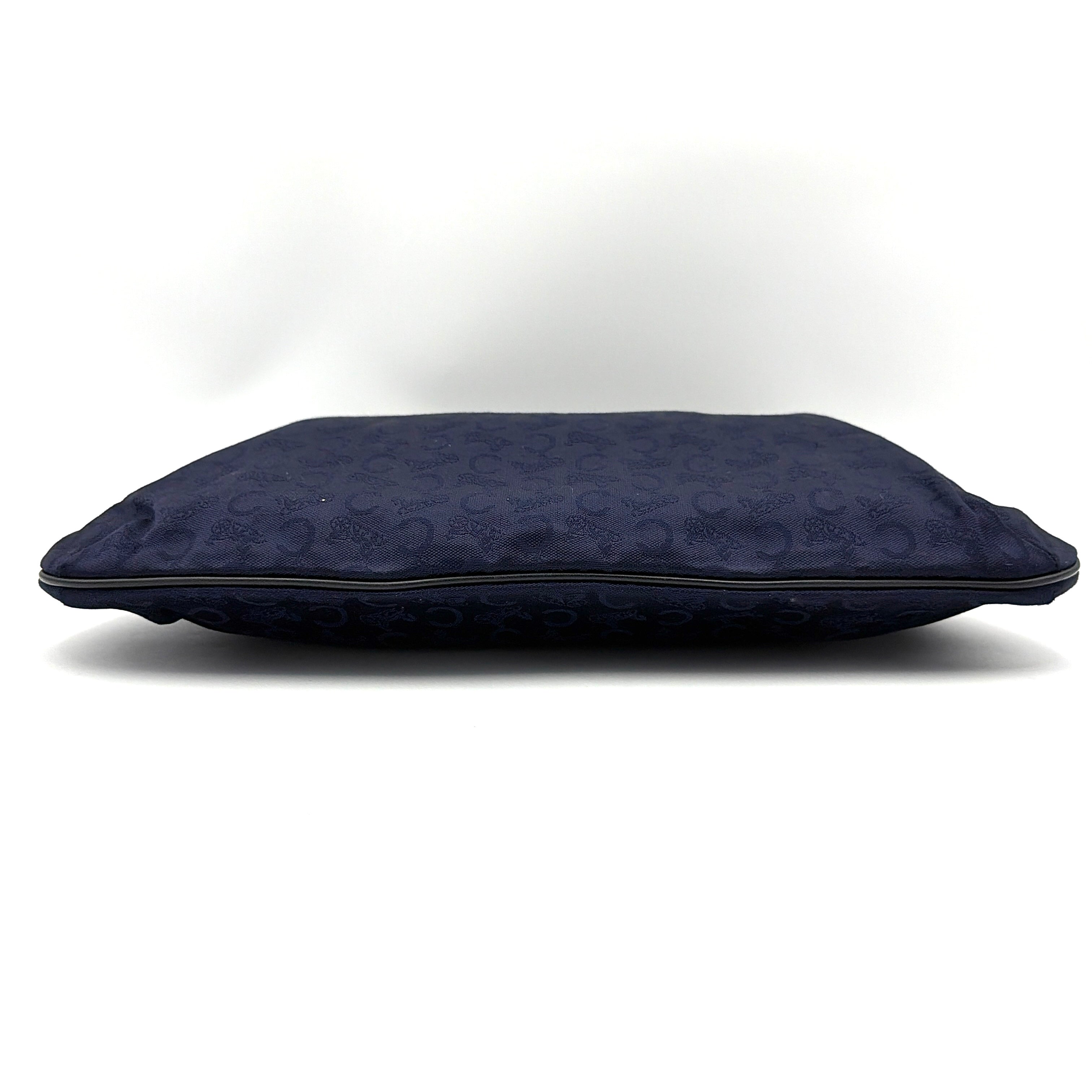 Celine Noevir Macadam Foldover Tote in navy jacquard with carriage motif, leather trim and cutout handles, photographed against a white background.