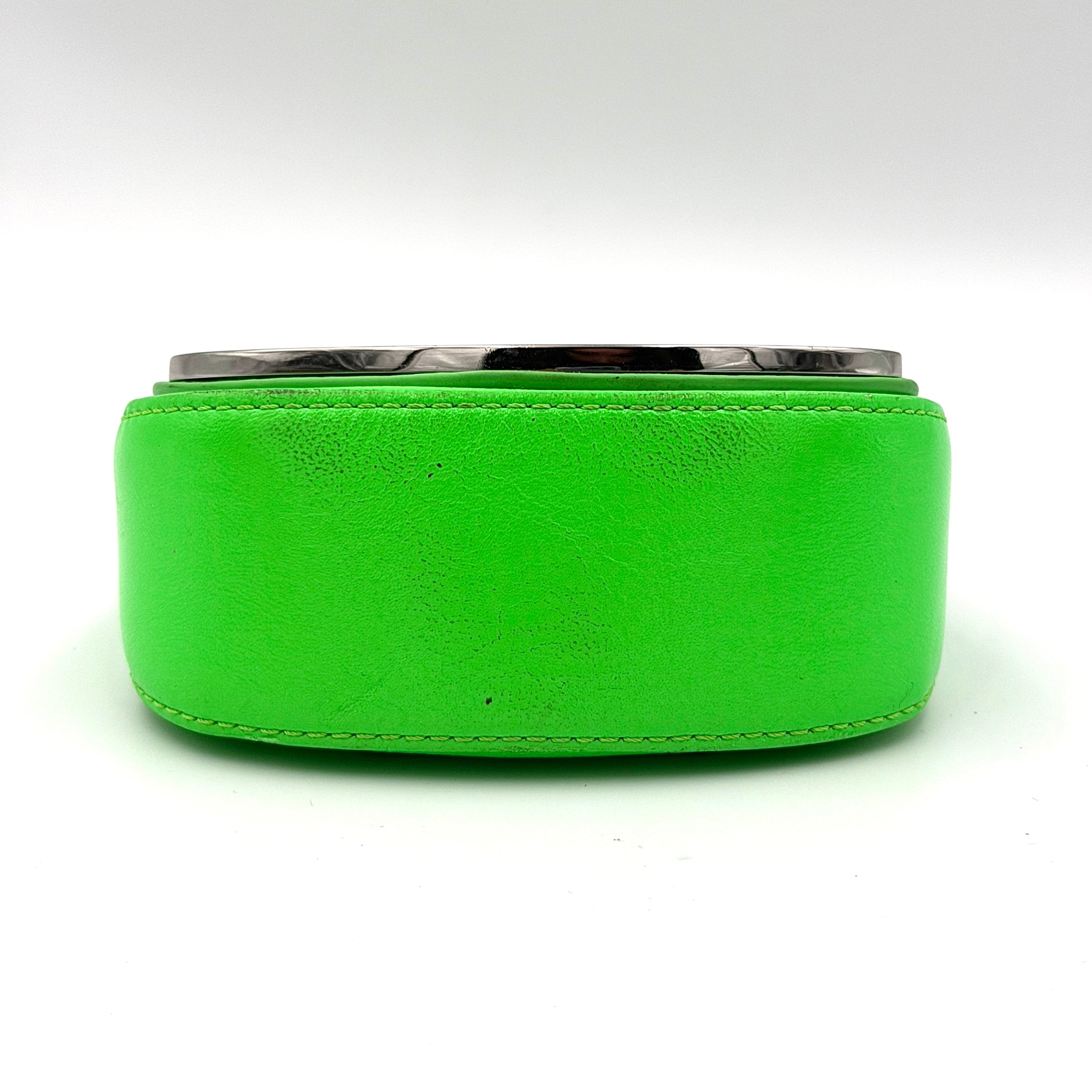 Diesel 1DR-XS Mini Bag in vivid neon green leather with bold silver D plaque and detachable strap, presented against a clean background.