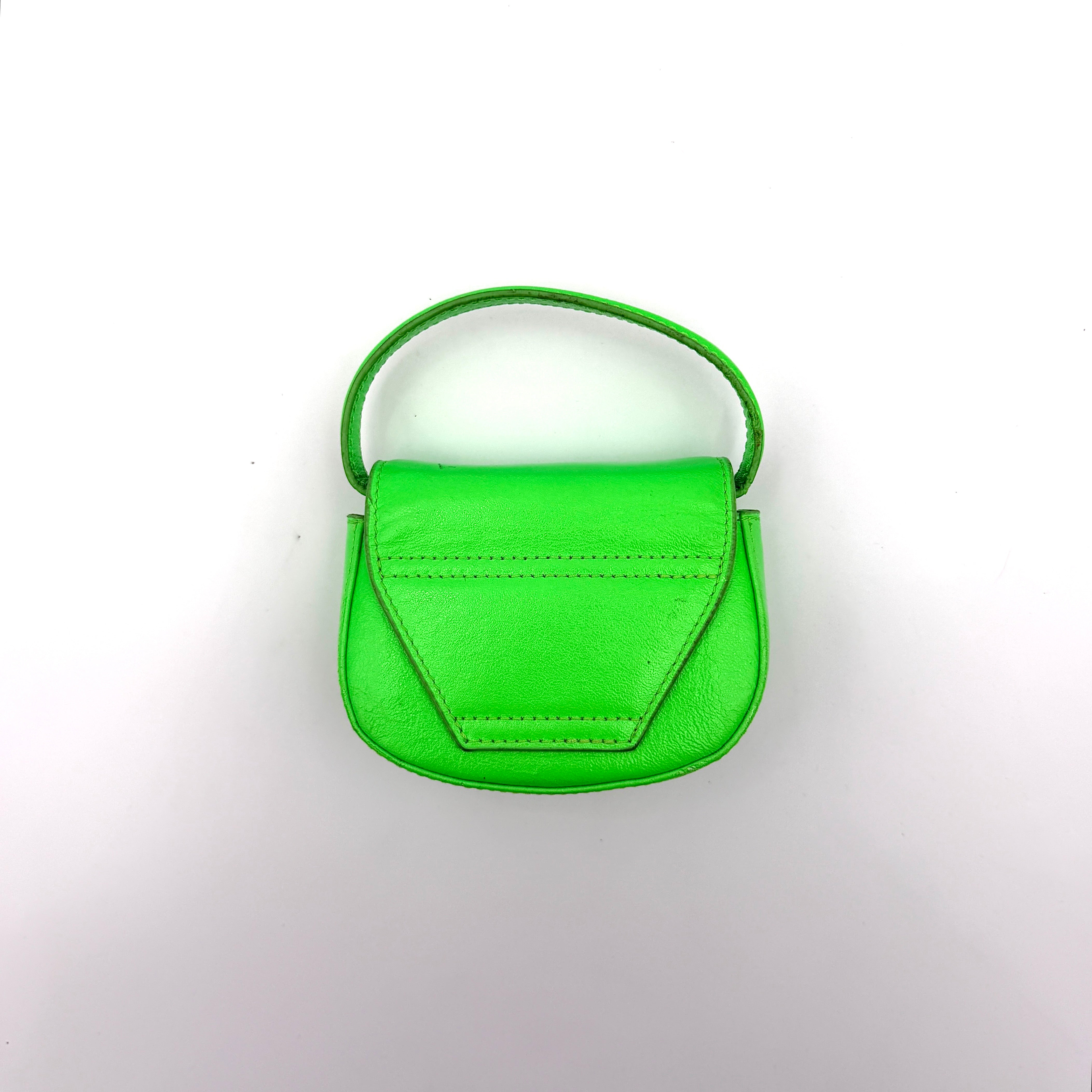 Diesel 1DR-XS Mini Bag in vivid neon green leather with bold silver D plaque and detachable strap, presented against a clean background.
