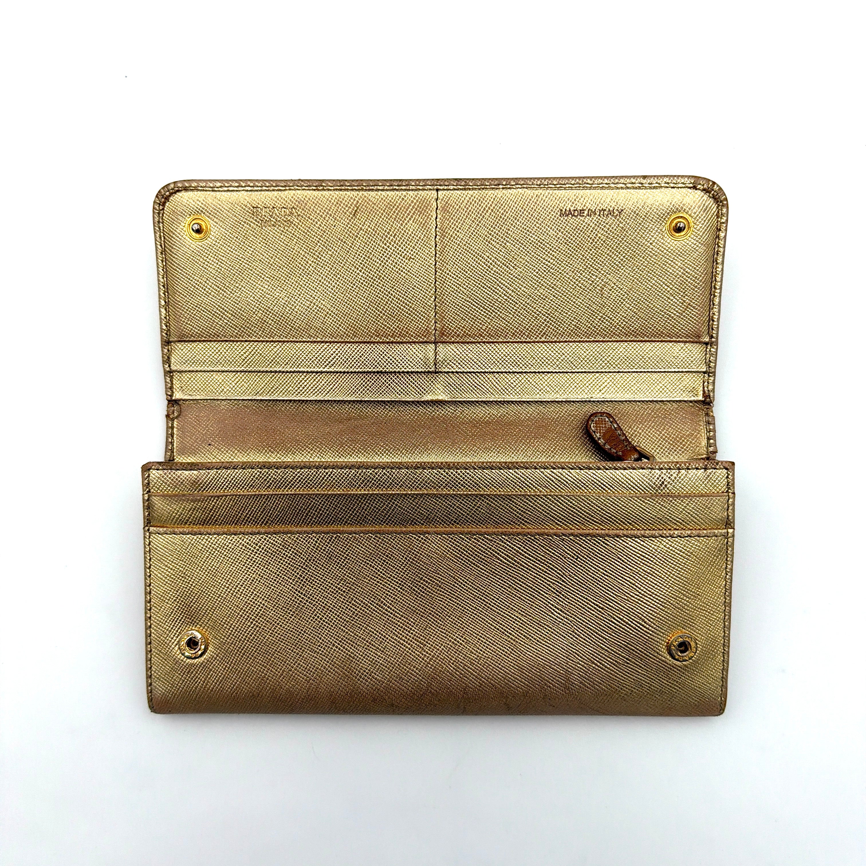 Prada Saffiano Continental Long Wallet in metallic gold Saffiano leather with gold-tone logo and structured silhouette.