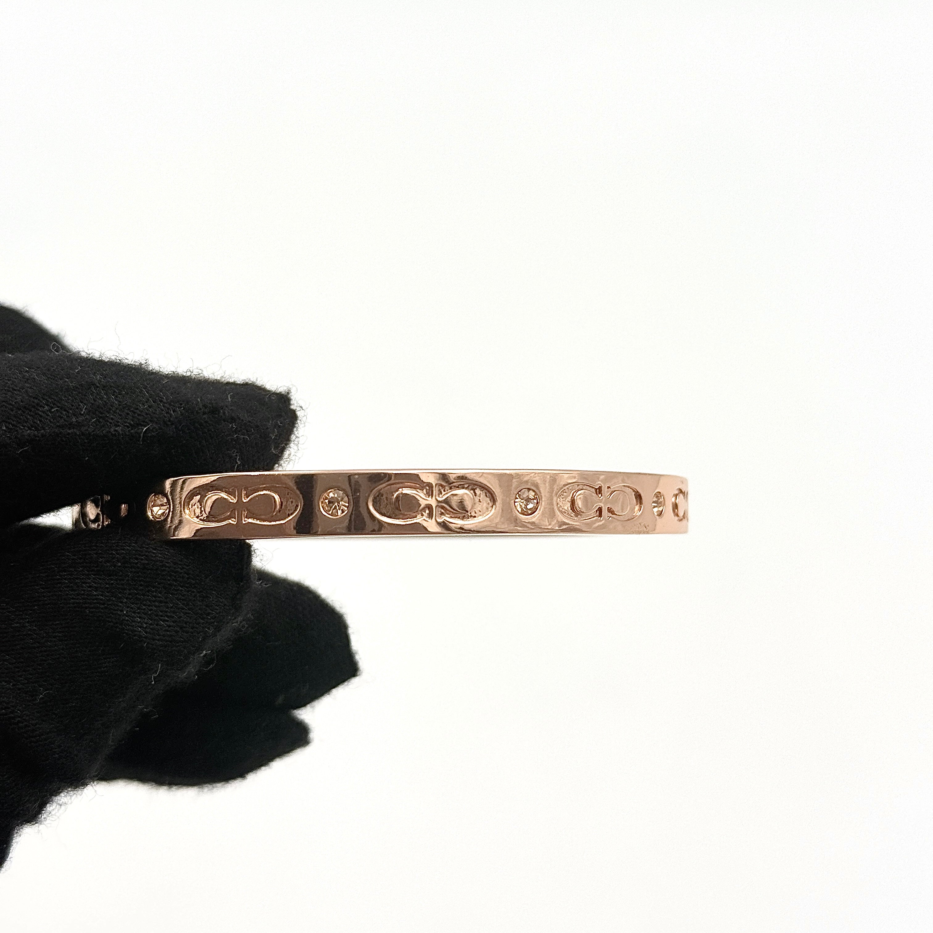 Coach Signature Kissing C Hinged Bangle Bracelet Rose Gold