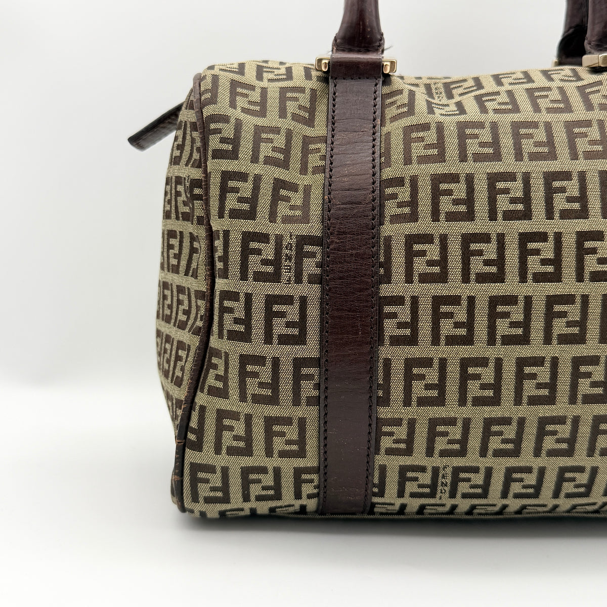 Fendi FF Zucchino Boston bag in brown monogram canvas with mahogany leather trim and gold hardware, photographed against a white background.