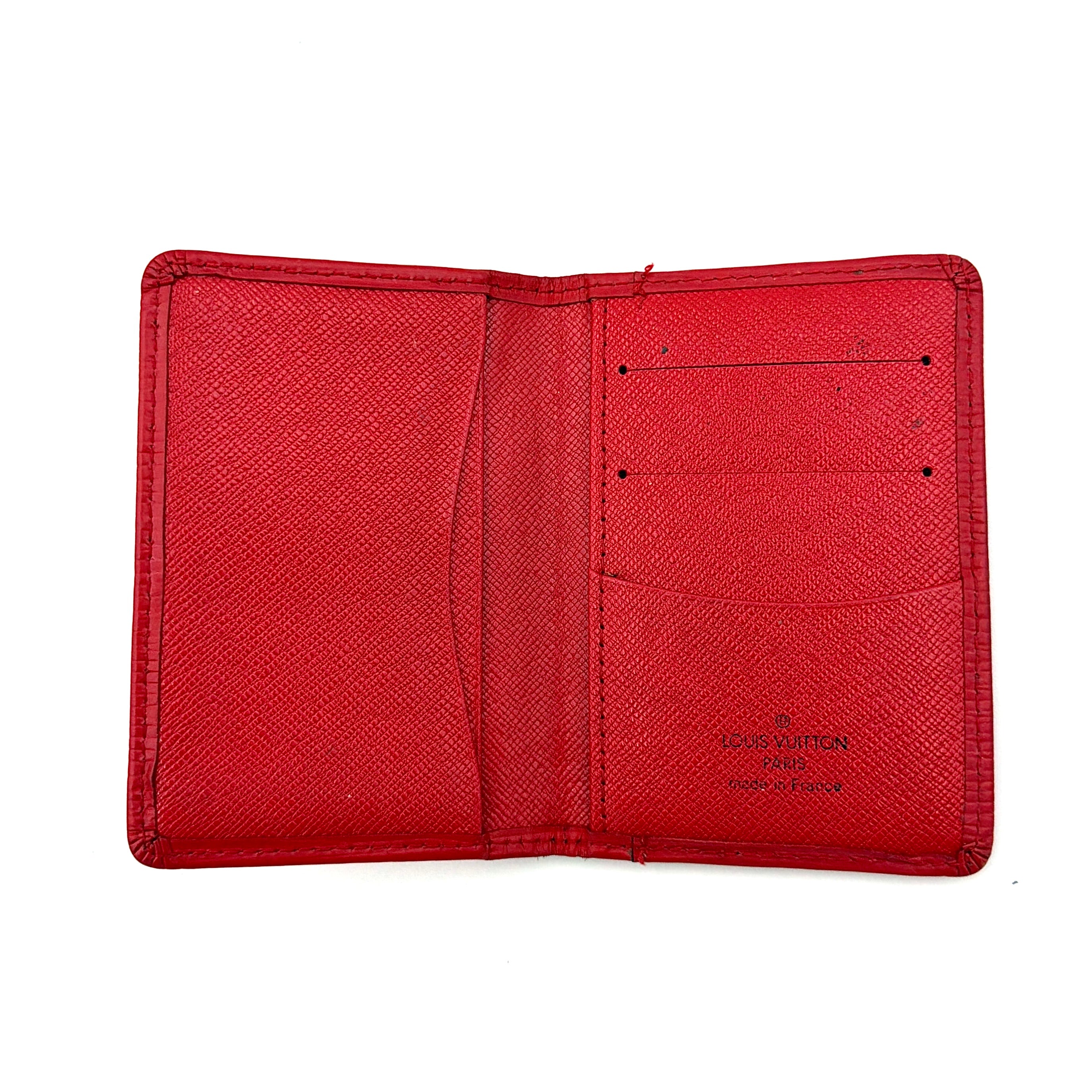 Front-facing view of the Louis Vuitton Epi Leather Pocket Organizer in a striking red, featuring subtle LV embossing and an elegant textured finish.