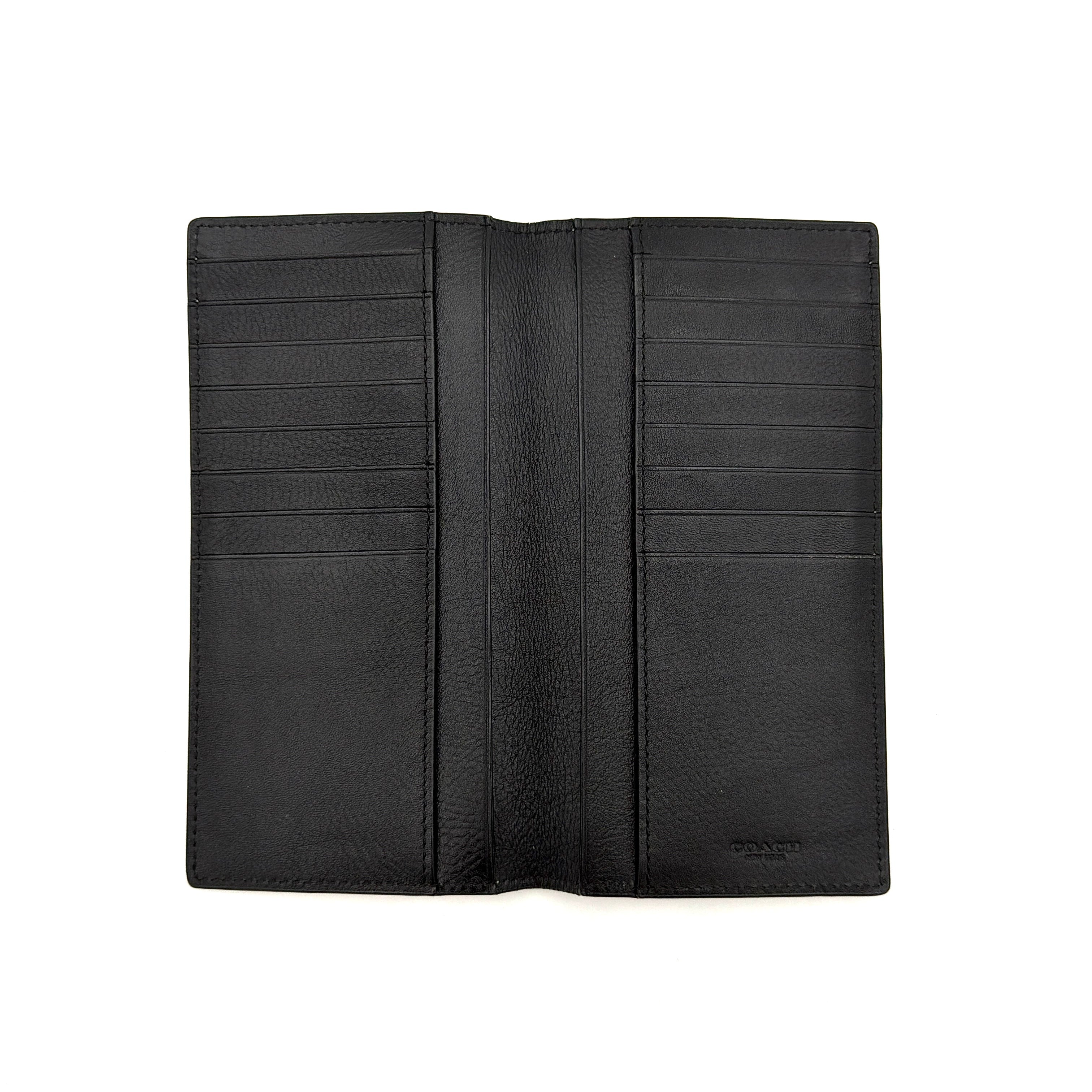 Coach Flap Long Wallet in navy blue leather with embossed logo, shown in a crisp editorial front view.