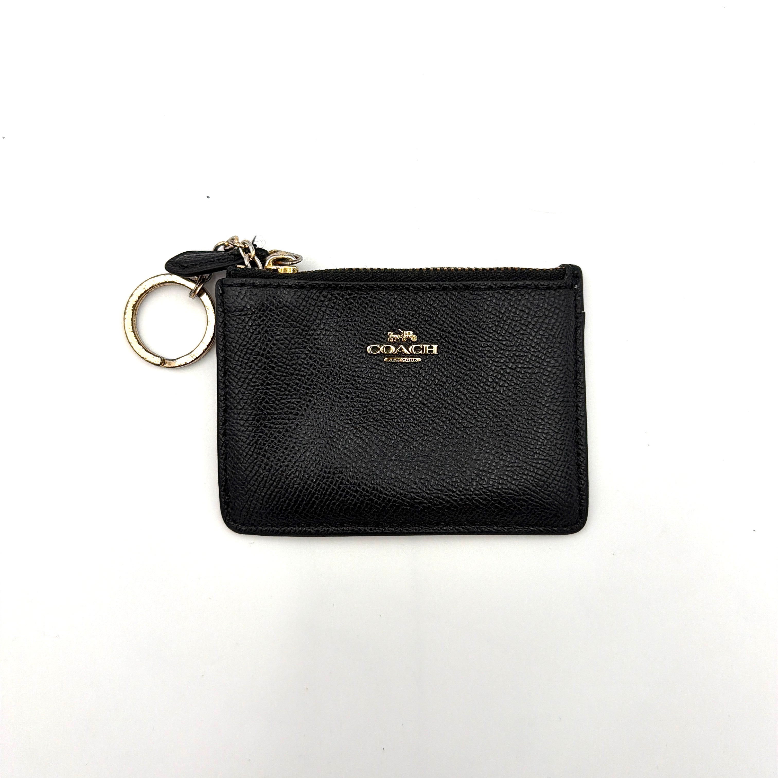Coach Mini Skinny ID Case Cardholder in black leather with gold-tone hardware, featuring a zip closure and signature logo detailing.