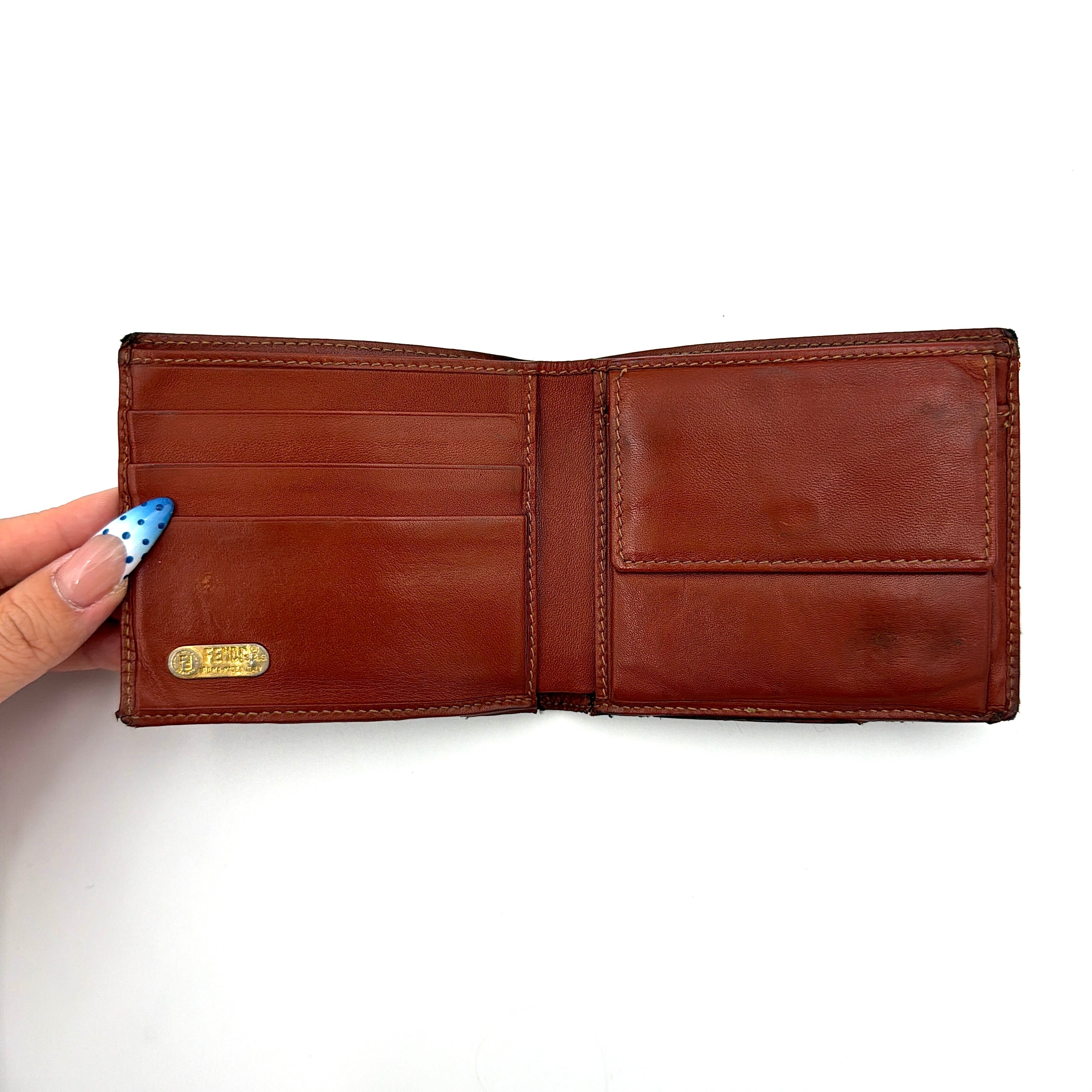 Fendi Pequin Stripe wallet in brown and black canvas with cognac leather trim and circular Fendi badge on the front.