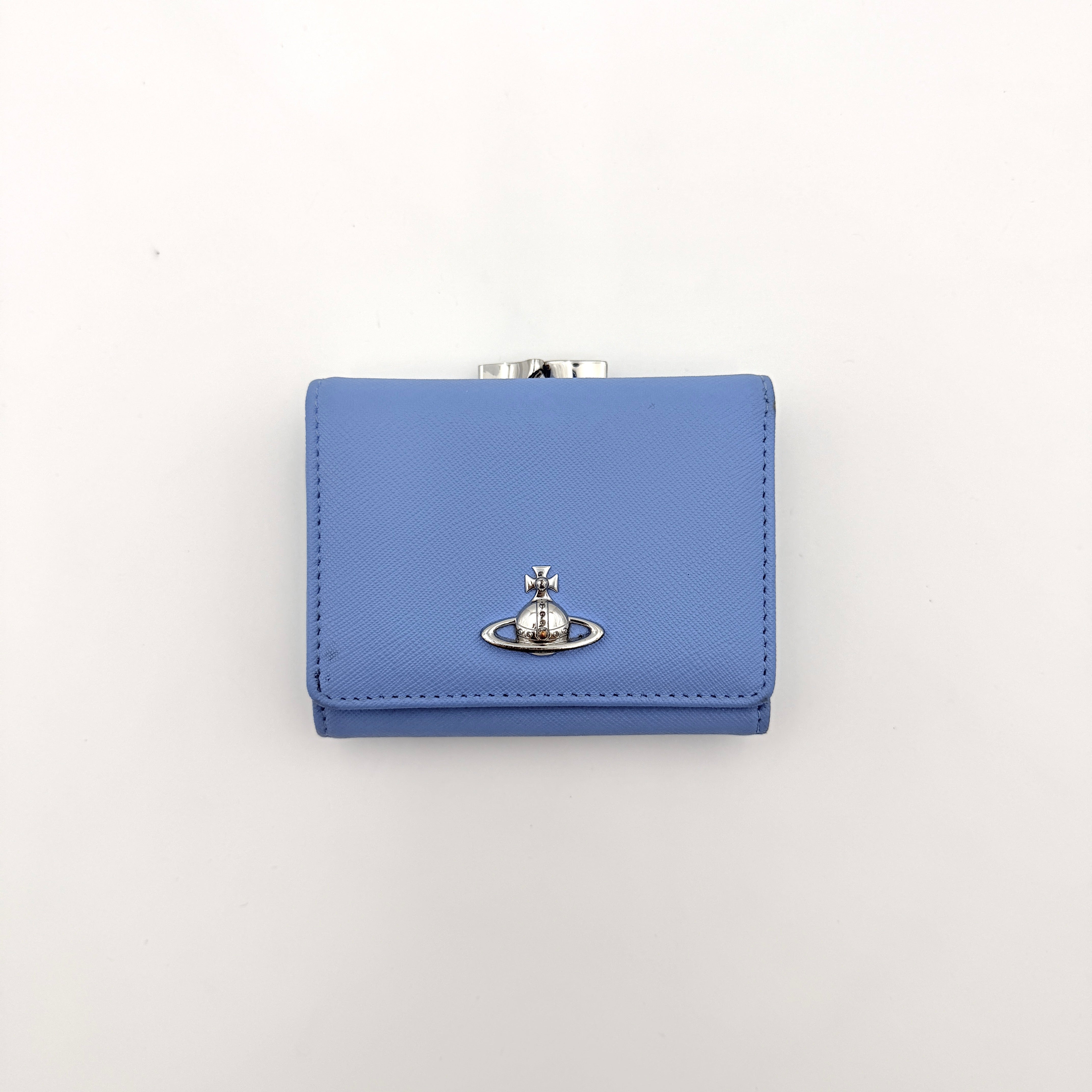 A baby blue leather Vivienne Westwood wallet with silver Orb logo and structured silhouette, photographed against a clean background.