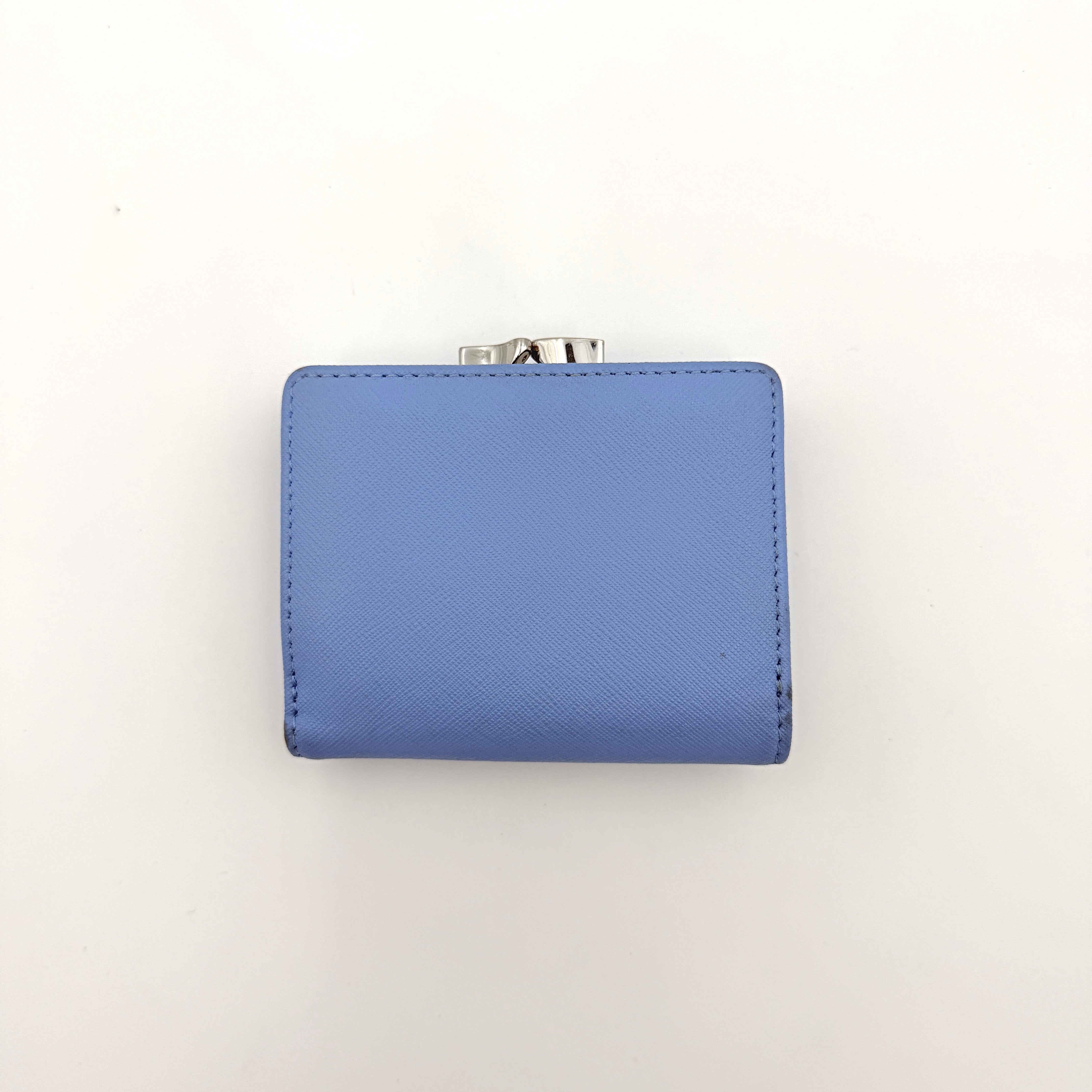 A baby blue leather Vivienne Westwood wallet with silver Orb logo and structured silhouette, photographed against a clean background.