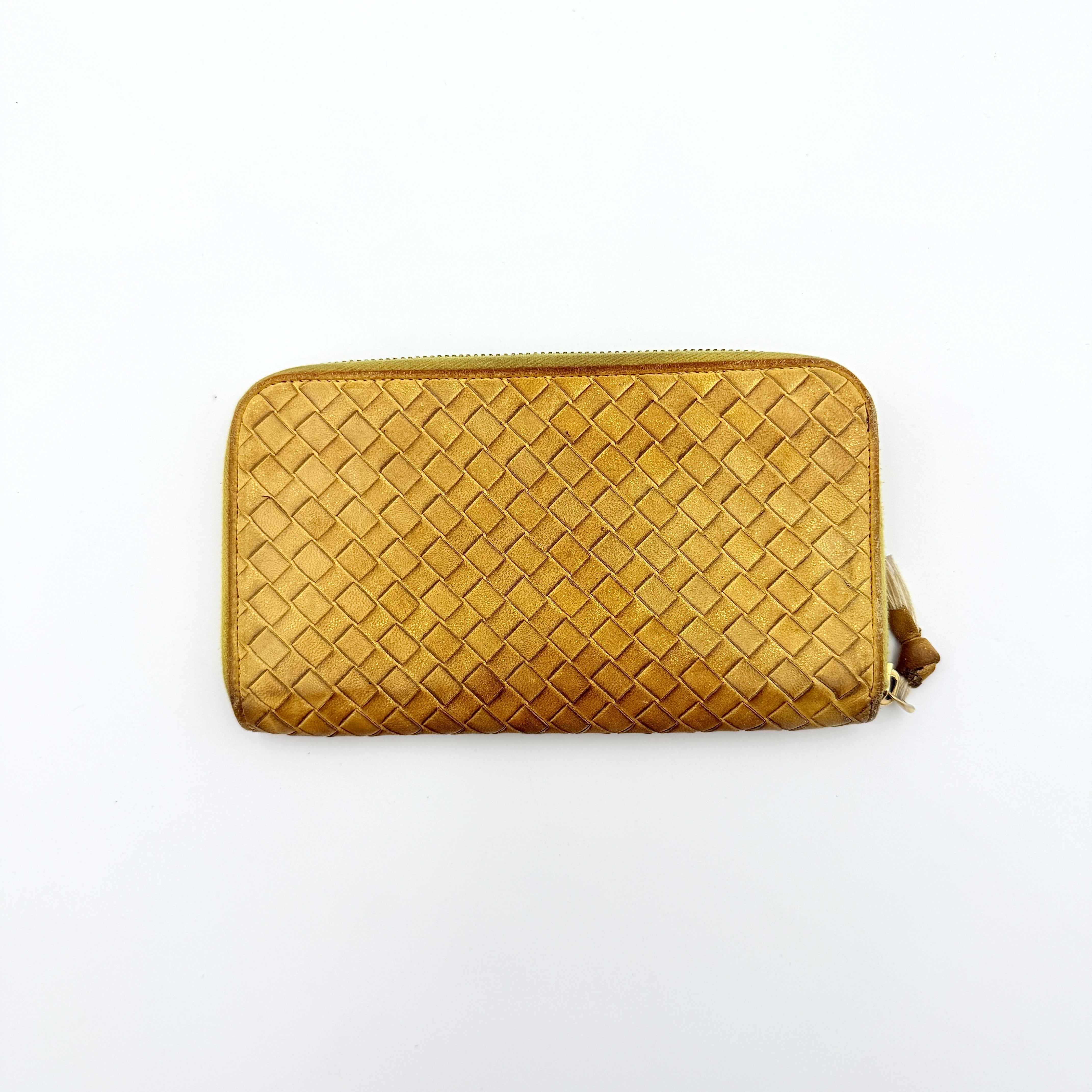 Bottega Veneta yellow Intrecciato woven leather long wallet with gold zip-around closure and signature leather pull.