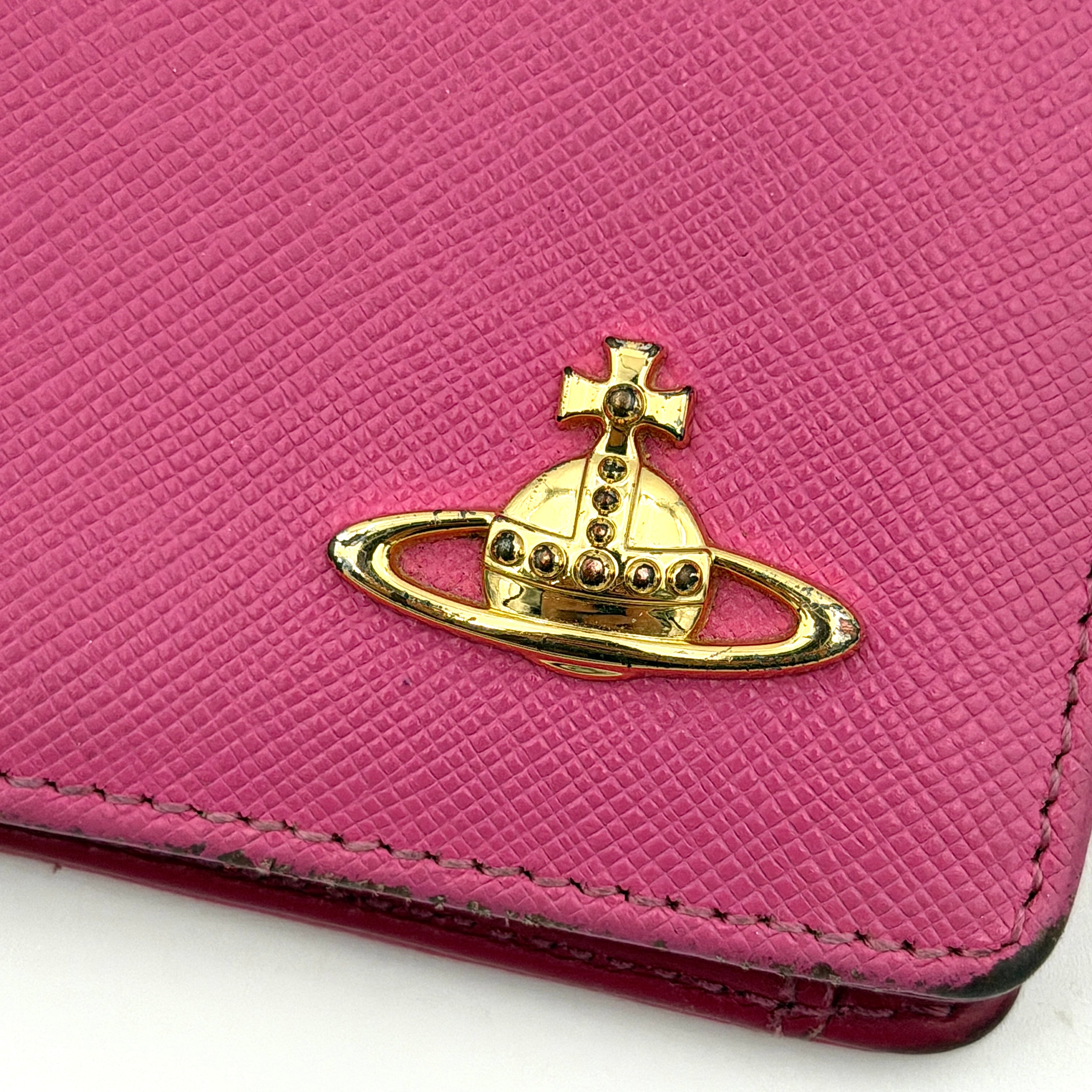 Vivienne Westwood Orb Saffiano Wallet in brilliant pink with gold-tone Orb emblem and cross-grained leather texture.