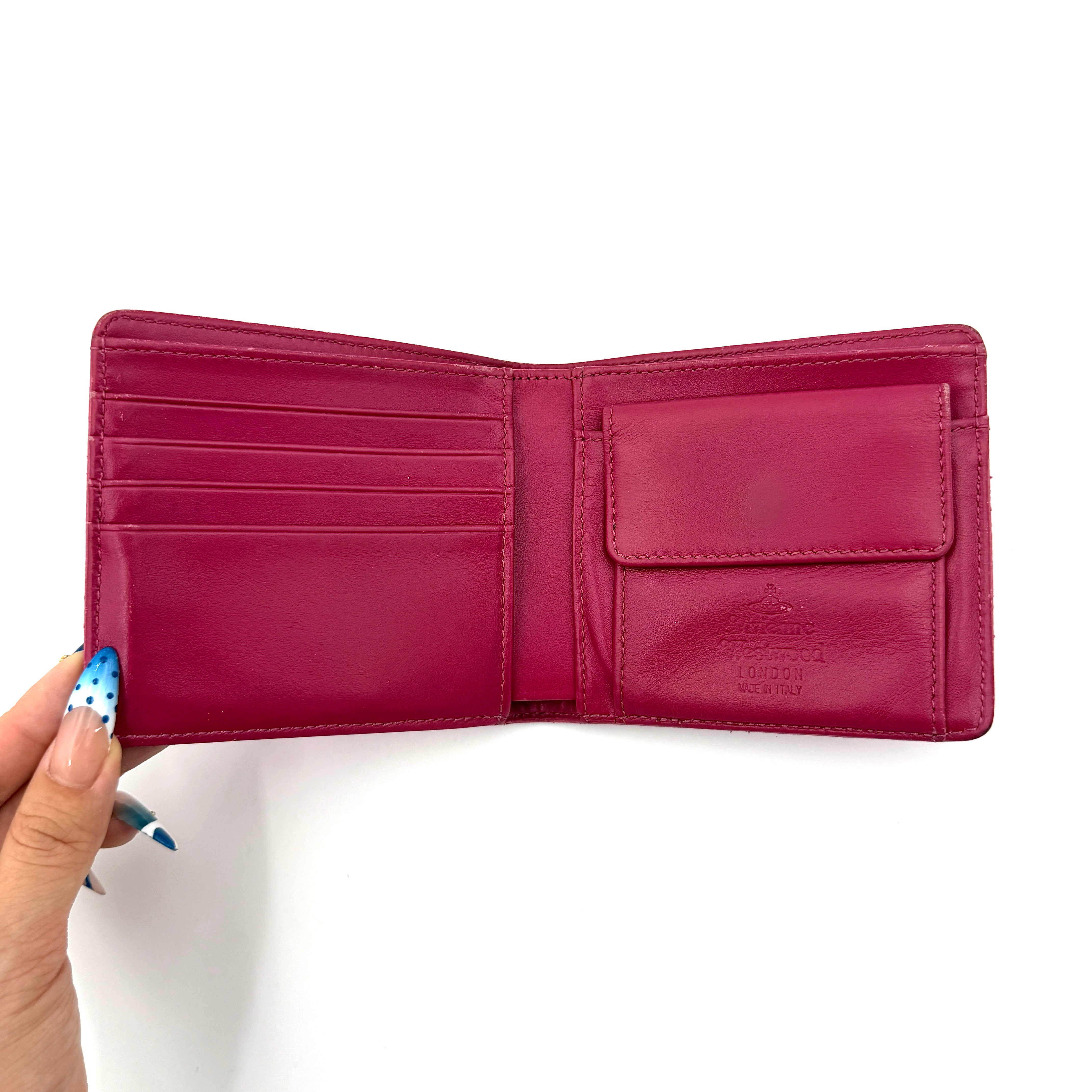 Vivienne Westwood Orb Saffiano Wallet in brilliant pink with gold-tone Orb emblem and cross-grained leather texture.