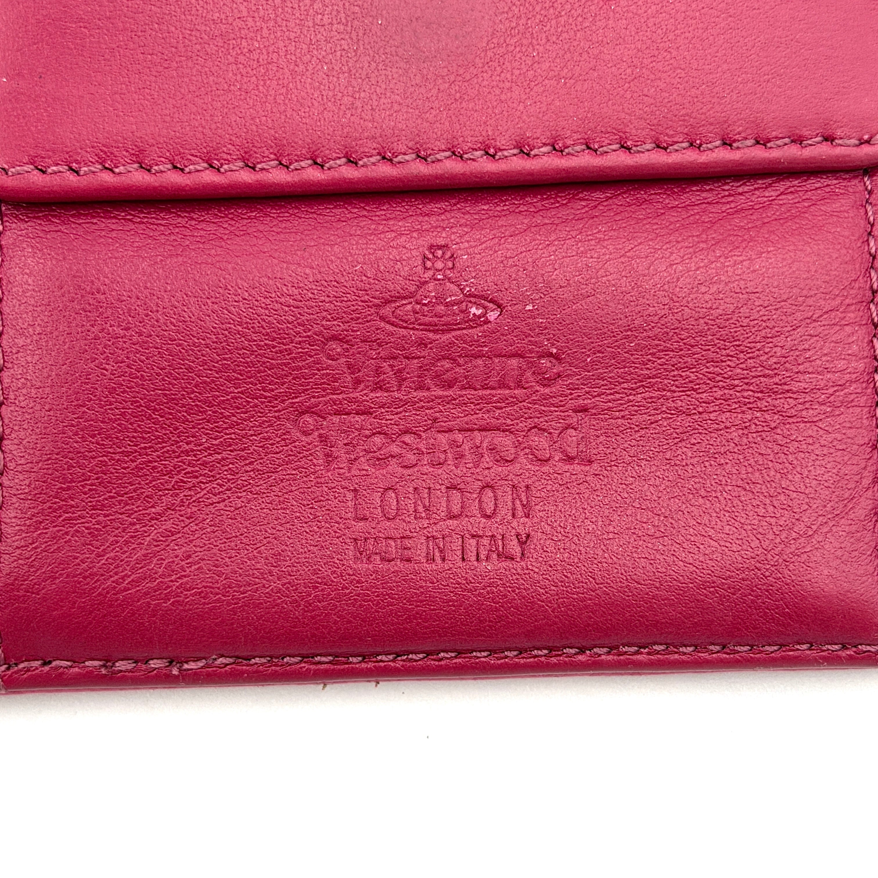 Vivienne Westwood Orb Saffiano Wallet in brilliant pink with gold-tone Orb emblem and cross-grained leather texture.