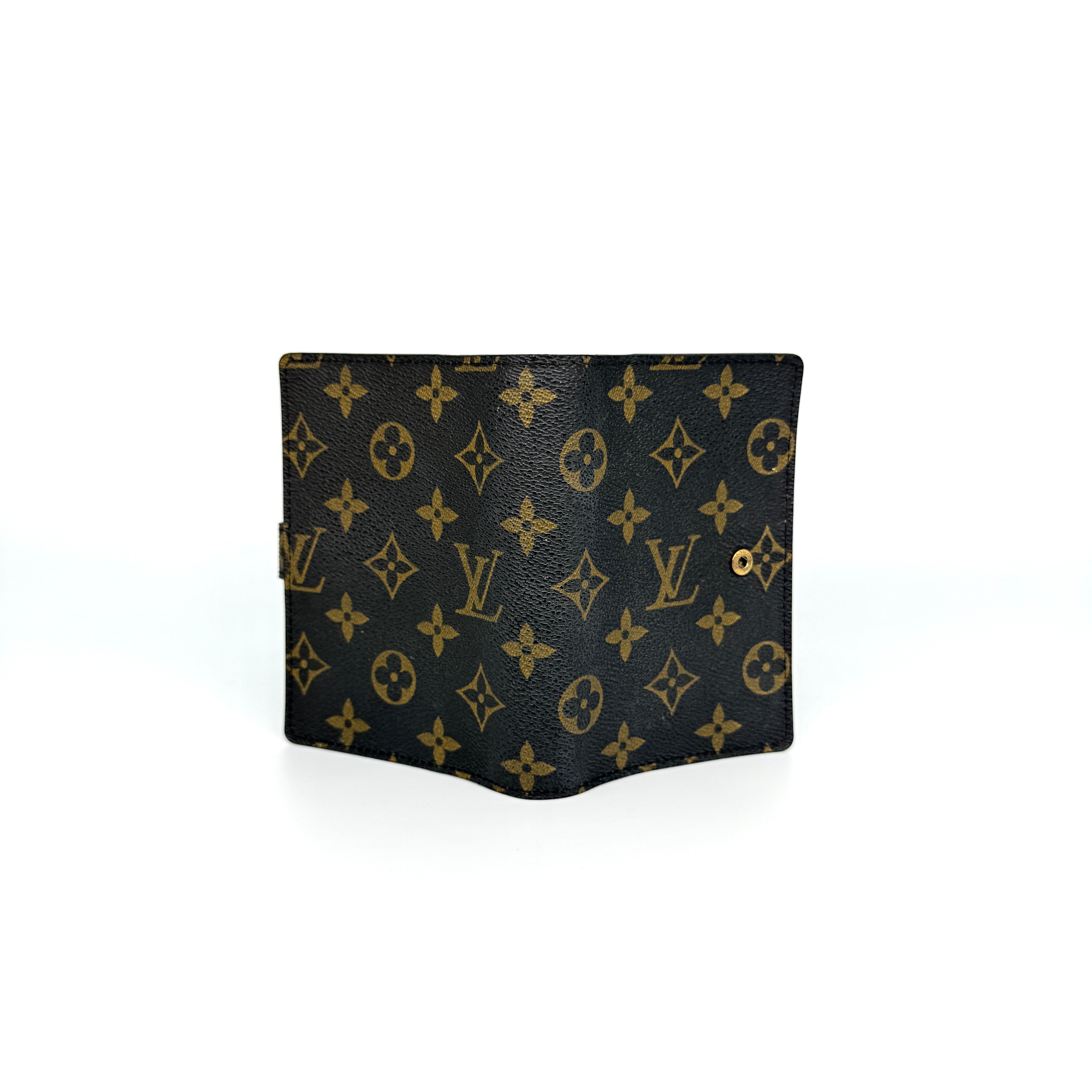 Louis Vuitton Monogram Agenda Cover in brown canvas with gold snap closure, displayed against a white background.