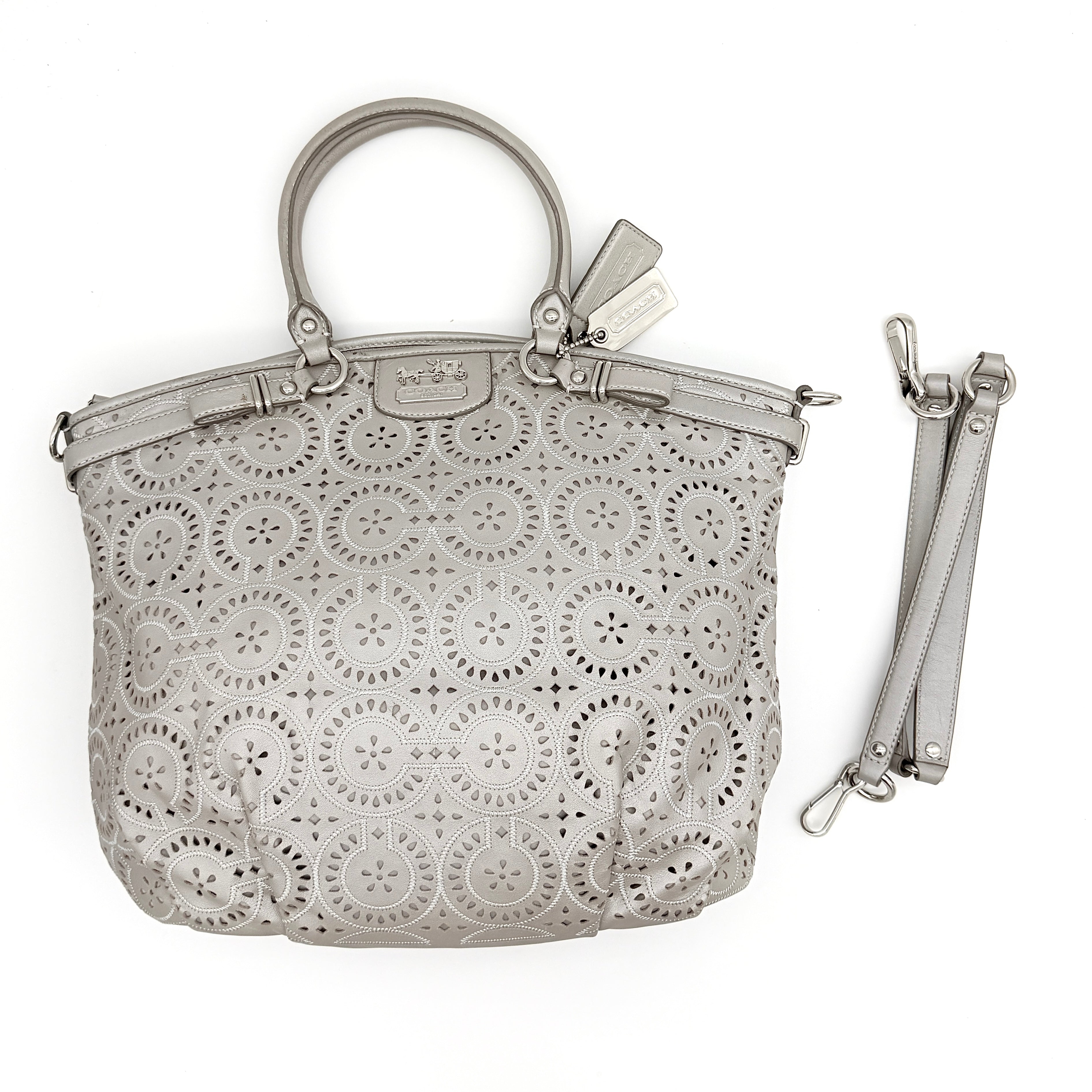 Coach Madison Sophia Shoulder Bag in silver leather with intricate cutout details, shown with original dust bag and detachable strap.