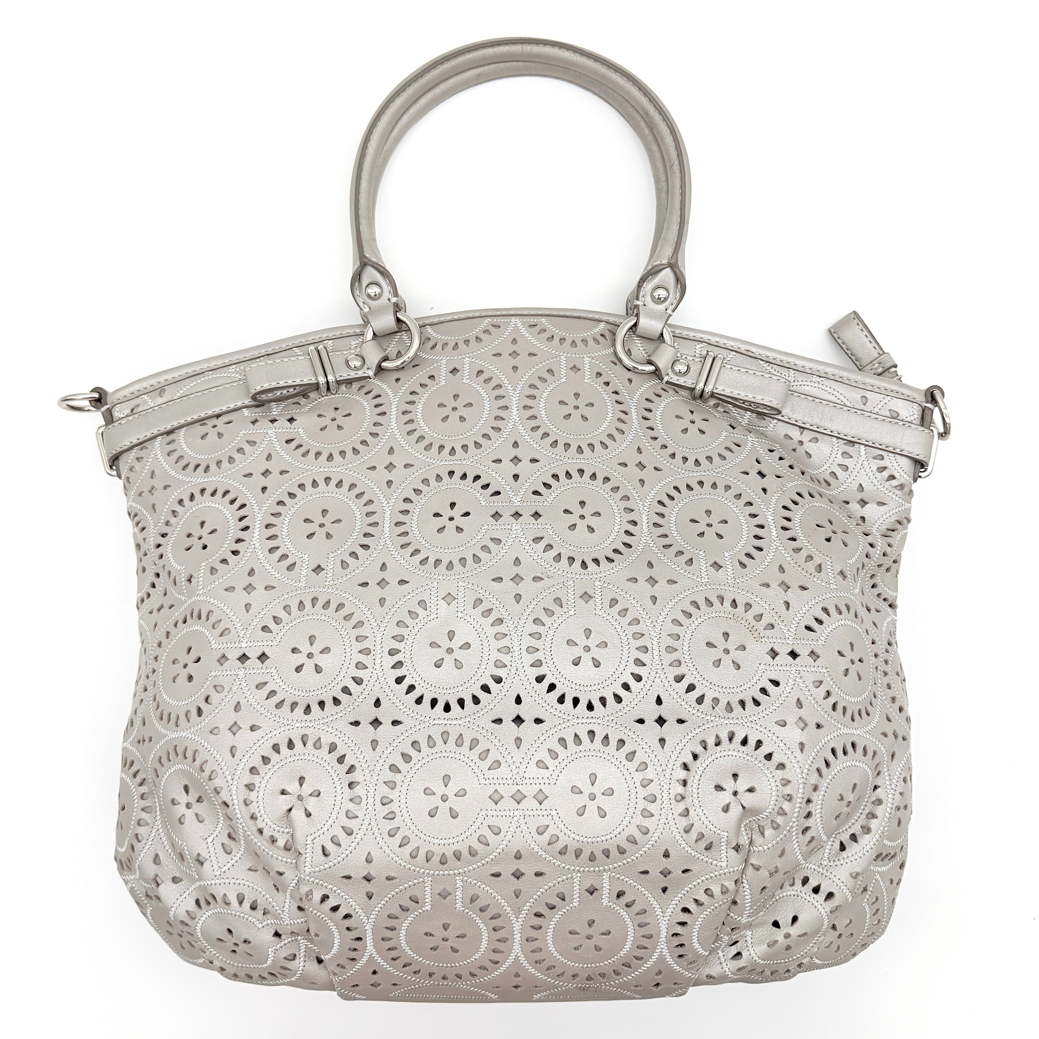 Coach Madison Sophia Shoulder Bag in silver leather with intricate cutout details, shown with original dust bag and detachable strap.