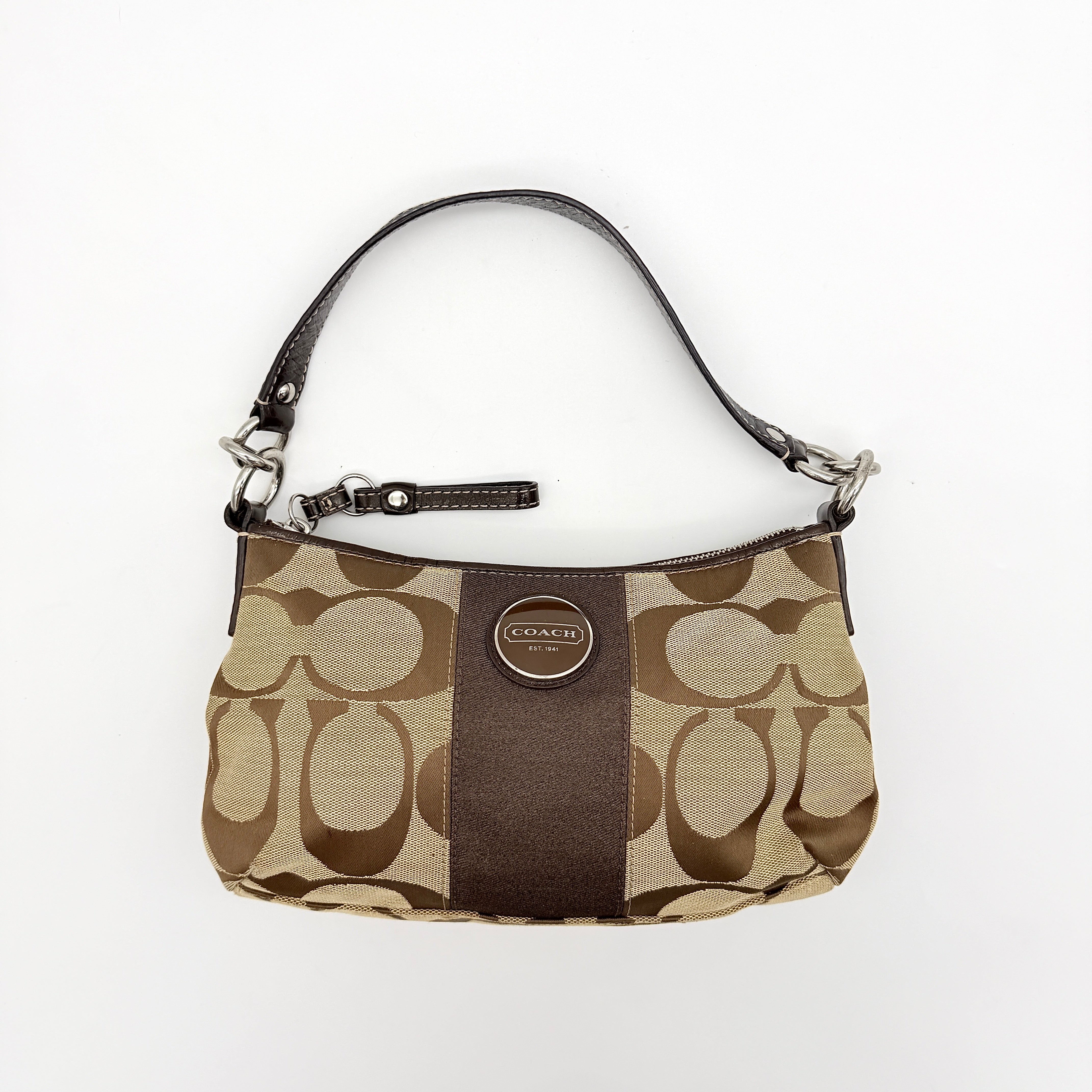 Coach beige and brown 2Way Signature Stripe shoulder bag with silver hardware, leather trim, and detachable straps.