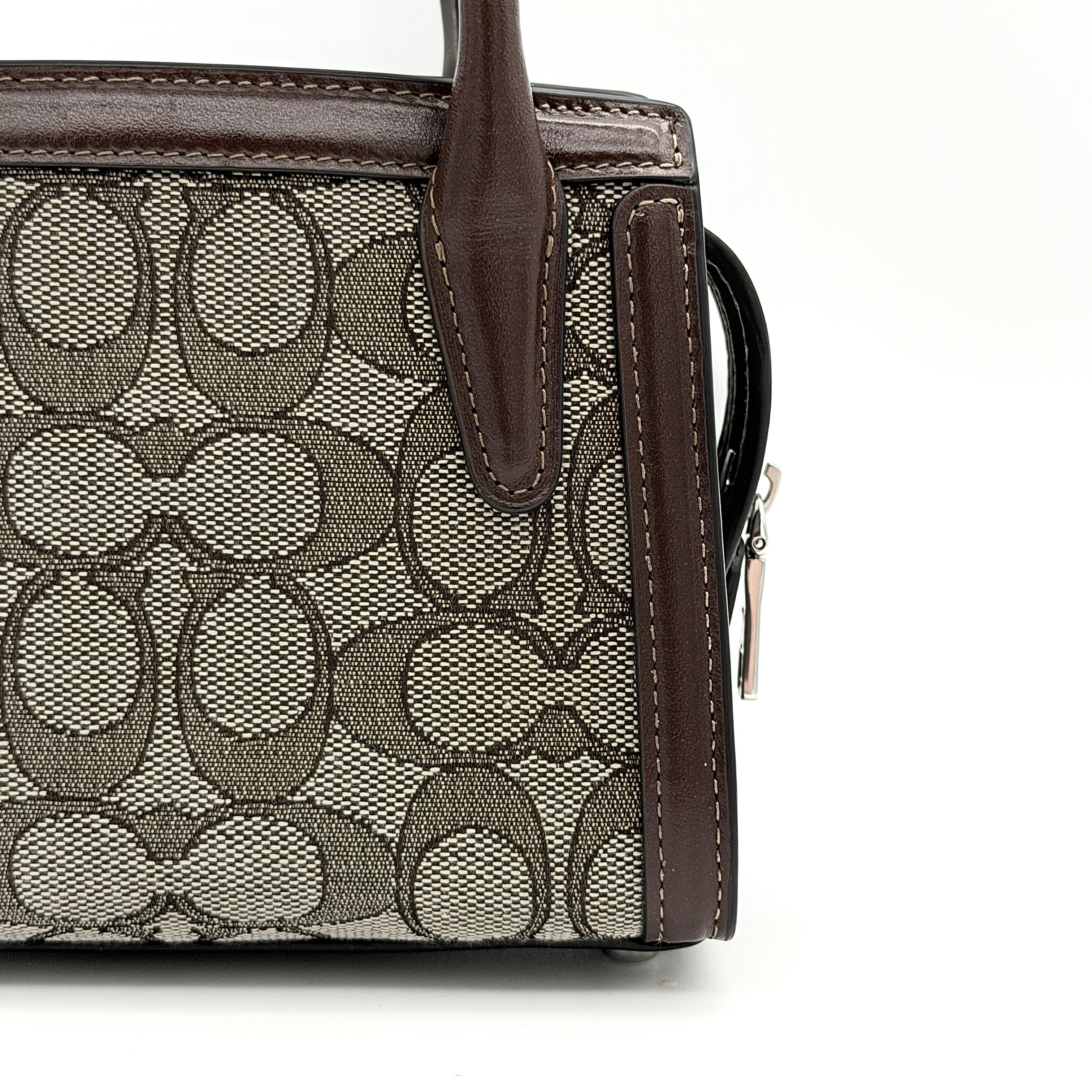 Front view of the Coach Signature Mini Andrea Carryall Shoulder Bag in brown canvas and leather with silver hardware.