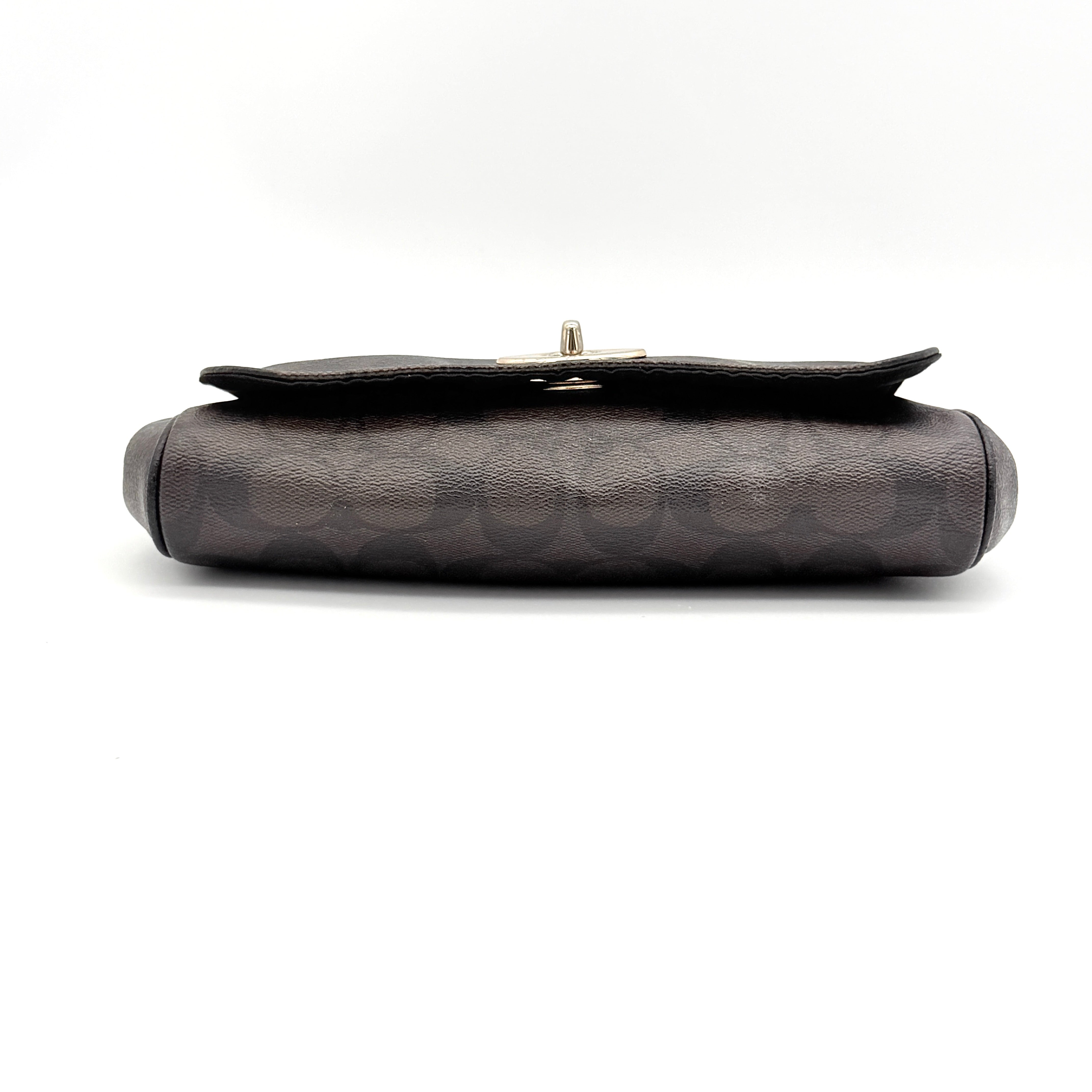 Coach Signature Ruby shoulder bag in brown and black with gold chain strap and detachable leather crossbody strap, displayed on a white background.