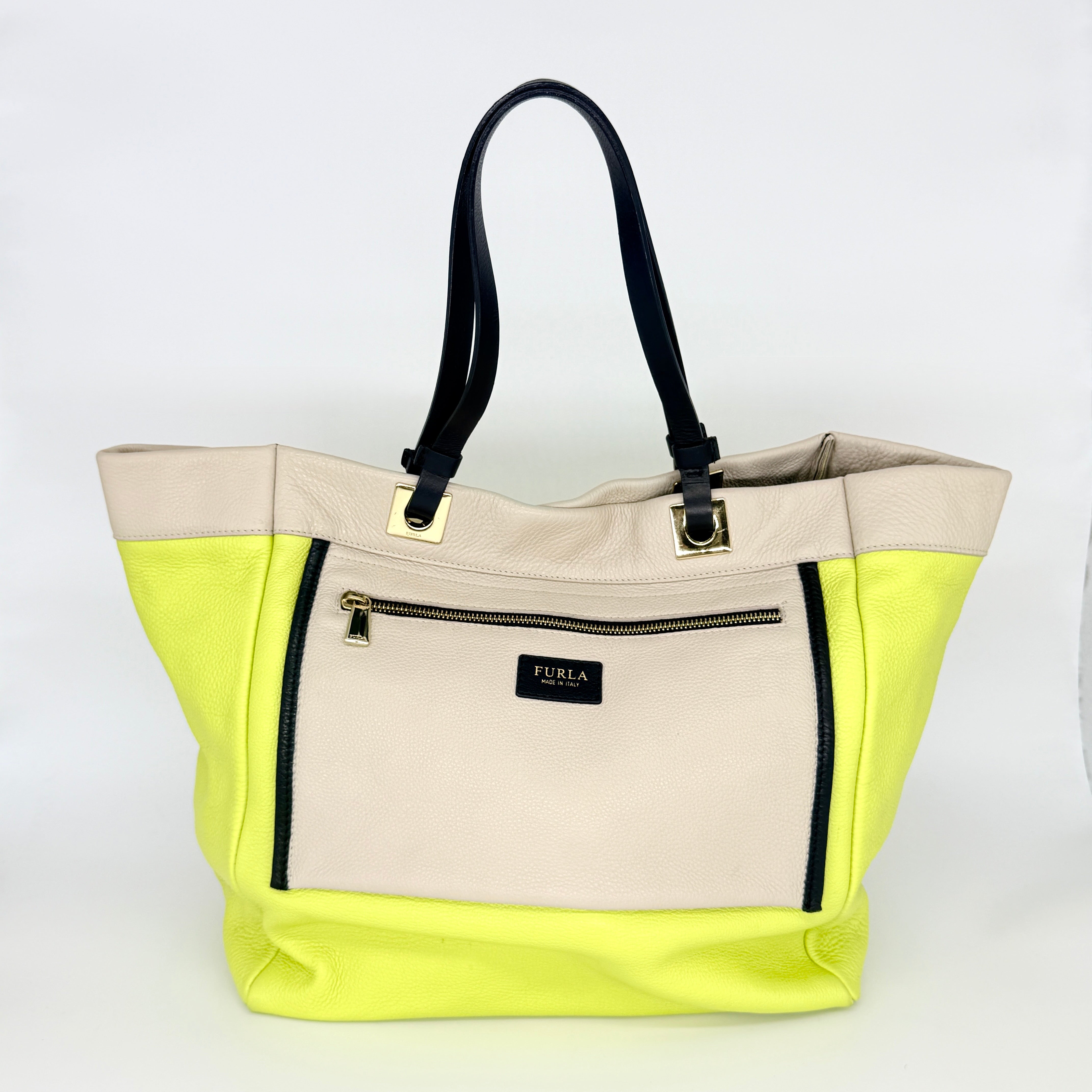 Furla Shopper Tote in neon yellow and beige grained leather with black handles and gold-tone hardware.