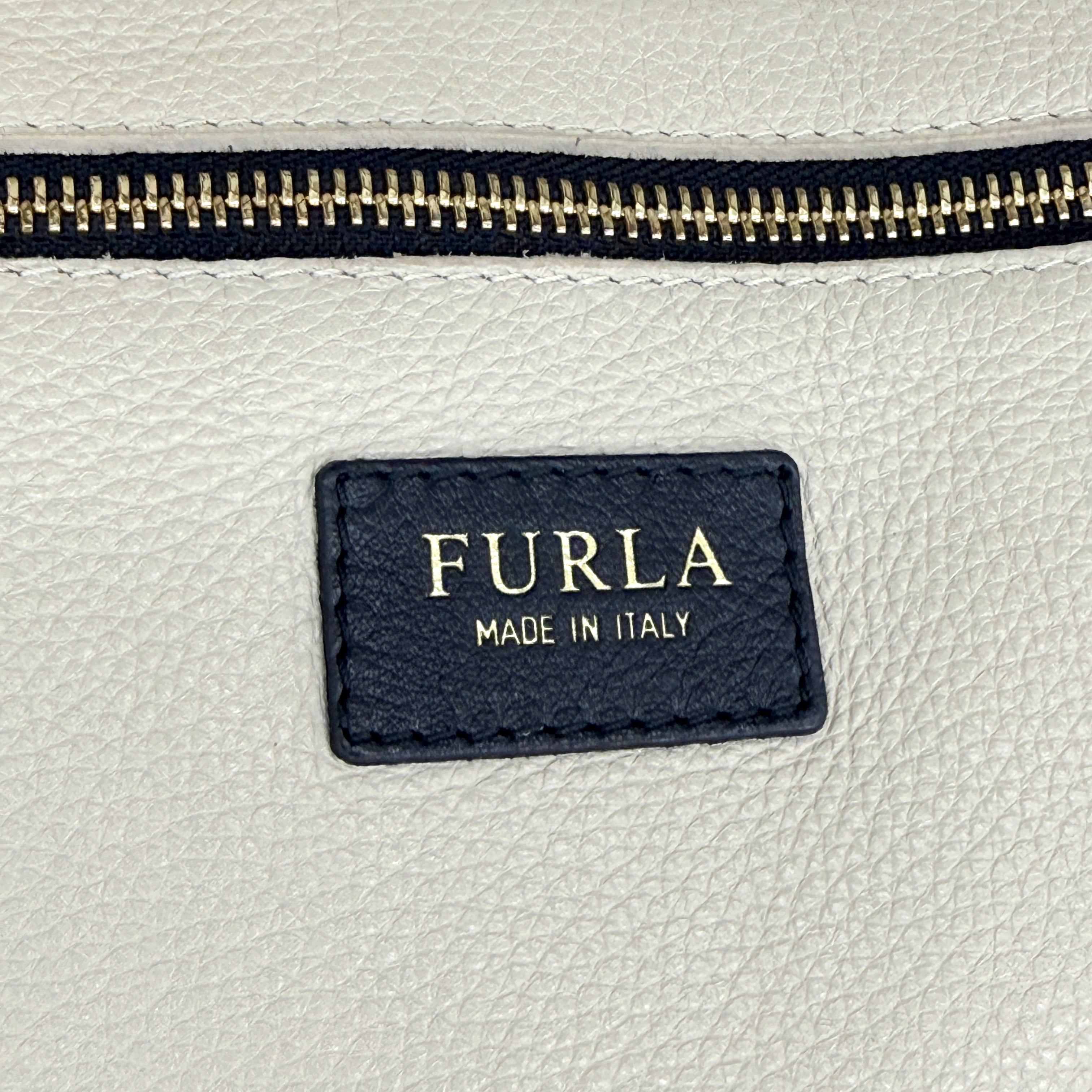 Furla Shopper Tote in neon yellow and beige grained leather with black handles and gold-tone hardware.