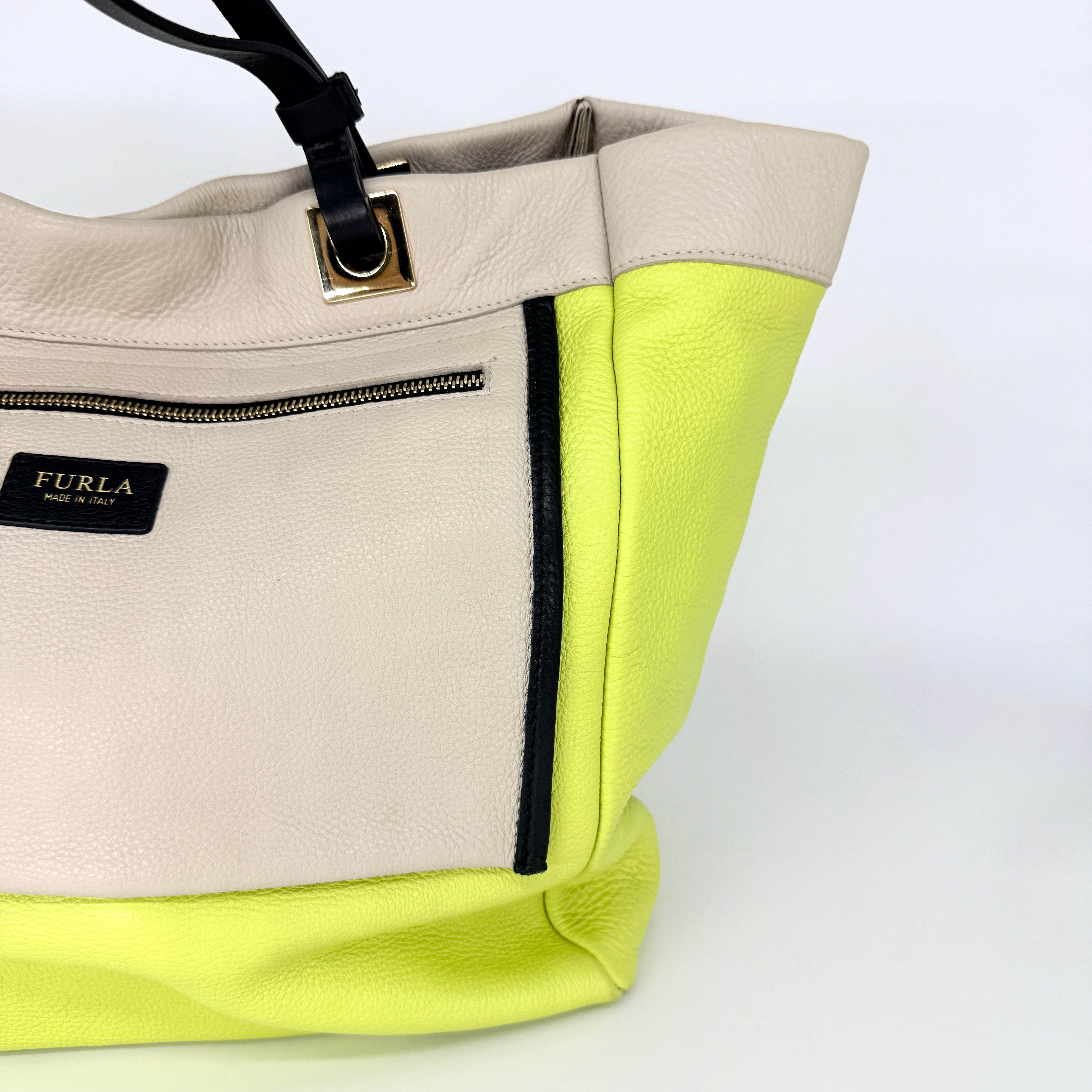 Furla Shopper Tote in neon yellow and beige grained leather with black handles and gold-tone hardware.