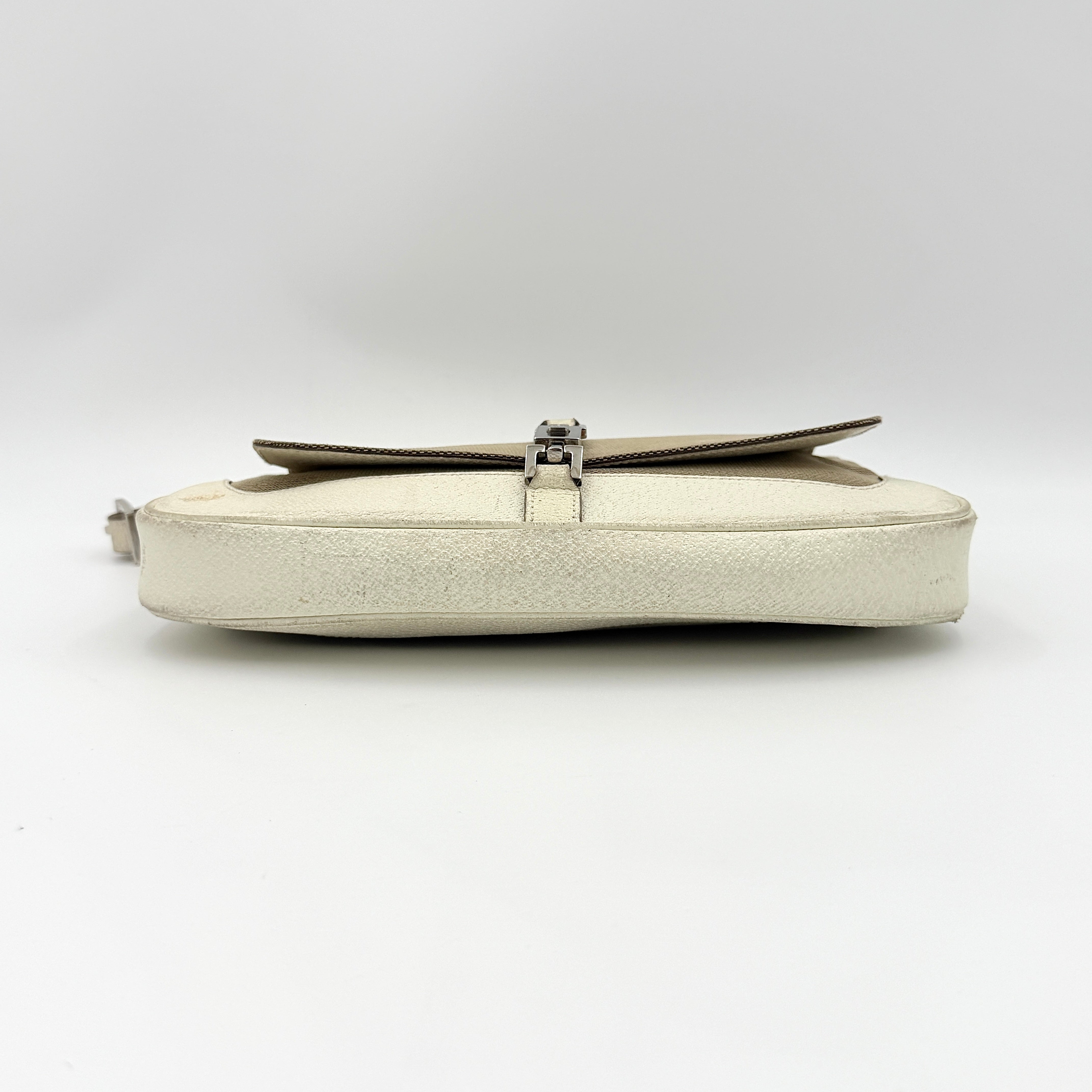 Gucci Jackie Shoulder Bag in brown canvas and white leather trim with silver-tone hardware, displayed against a clean background.