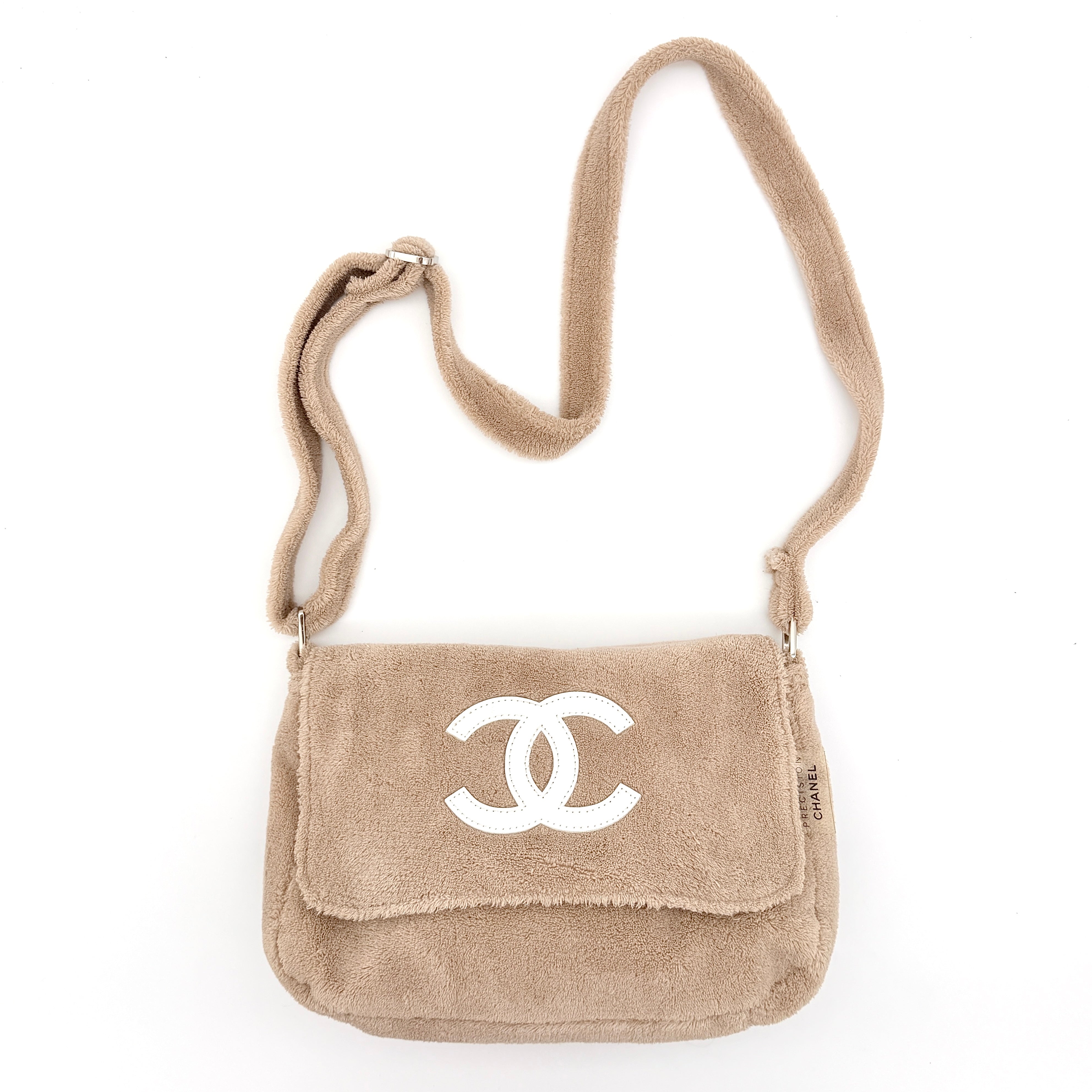Chanel CC Precision Fragrance Line crossbody bag in beige terry cloth with white logo, shown with long strap.