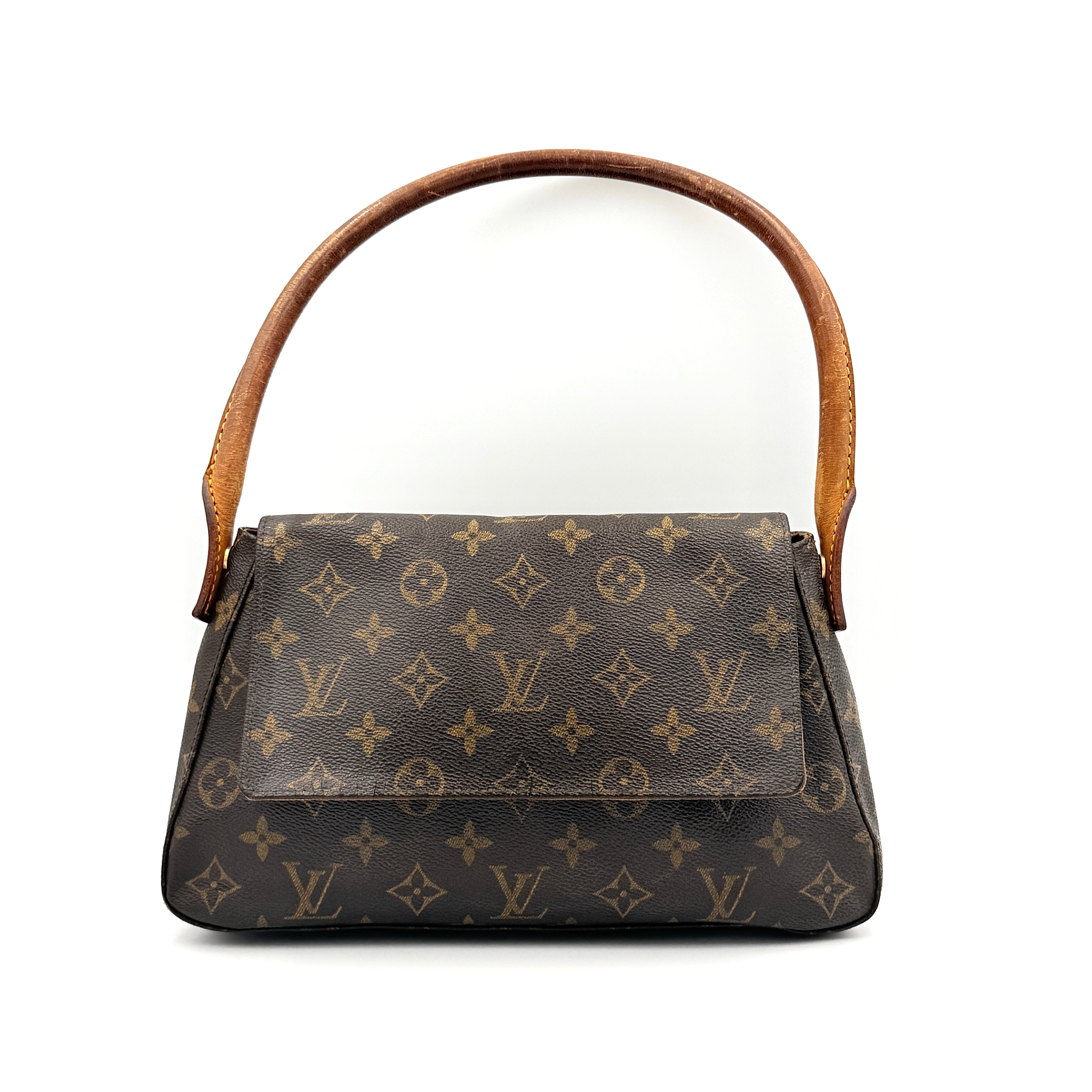 Louis Vuitton Monogram Mini Looping Shoulder Bag in brown monogram canvas with curved vachetta leather shoulder strap displayed upright.