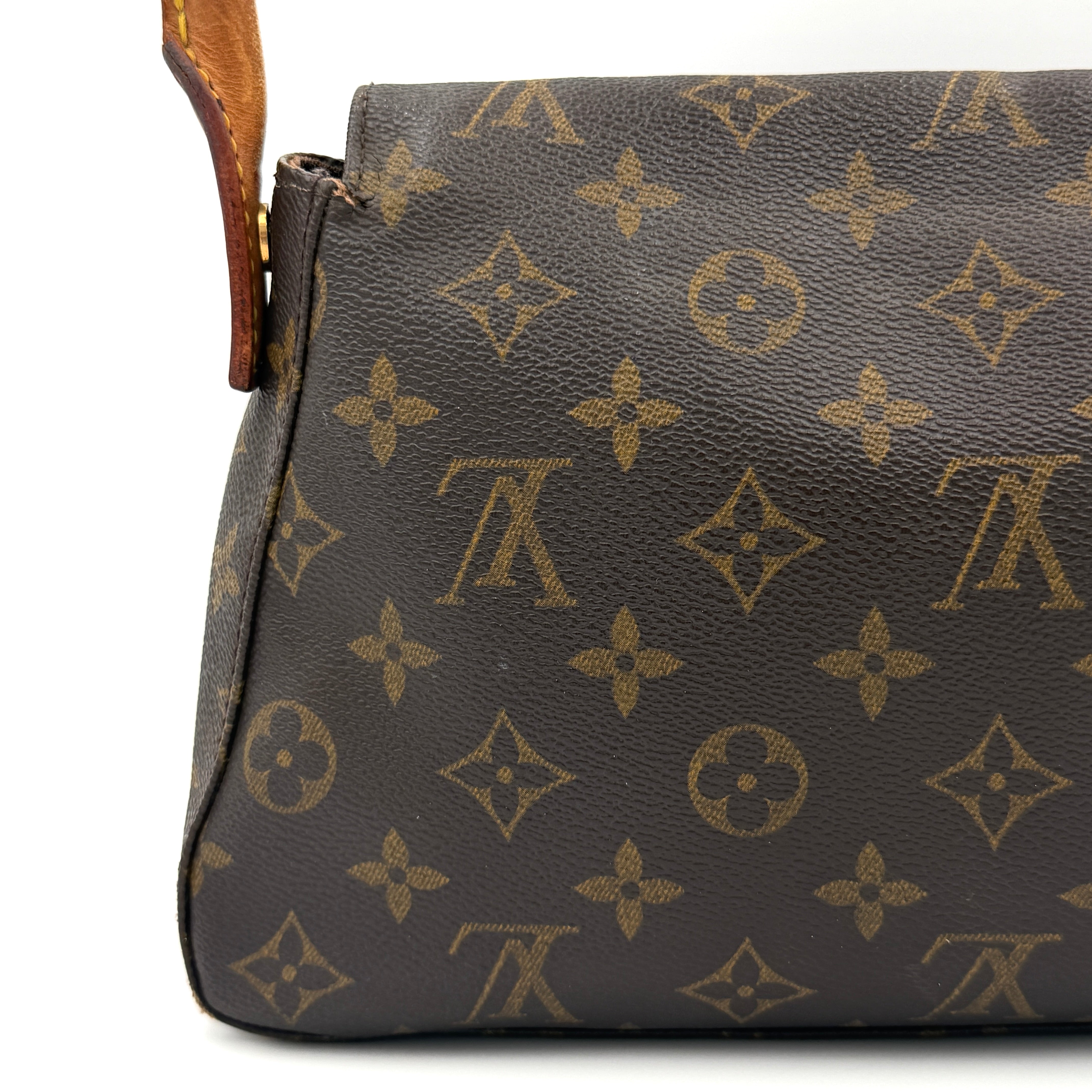 Louis Vuitton Monogram Mini Looping Shoulder Bag in brown monogram canvas with curved vachetta leather shoulder strap displayed upright.