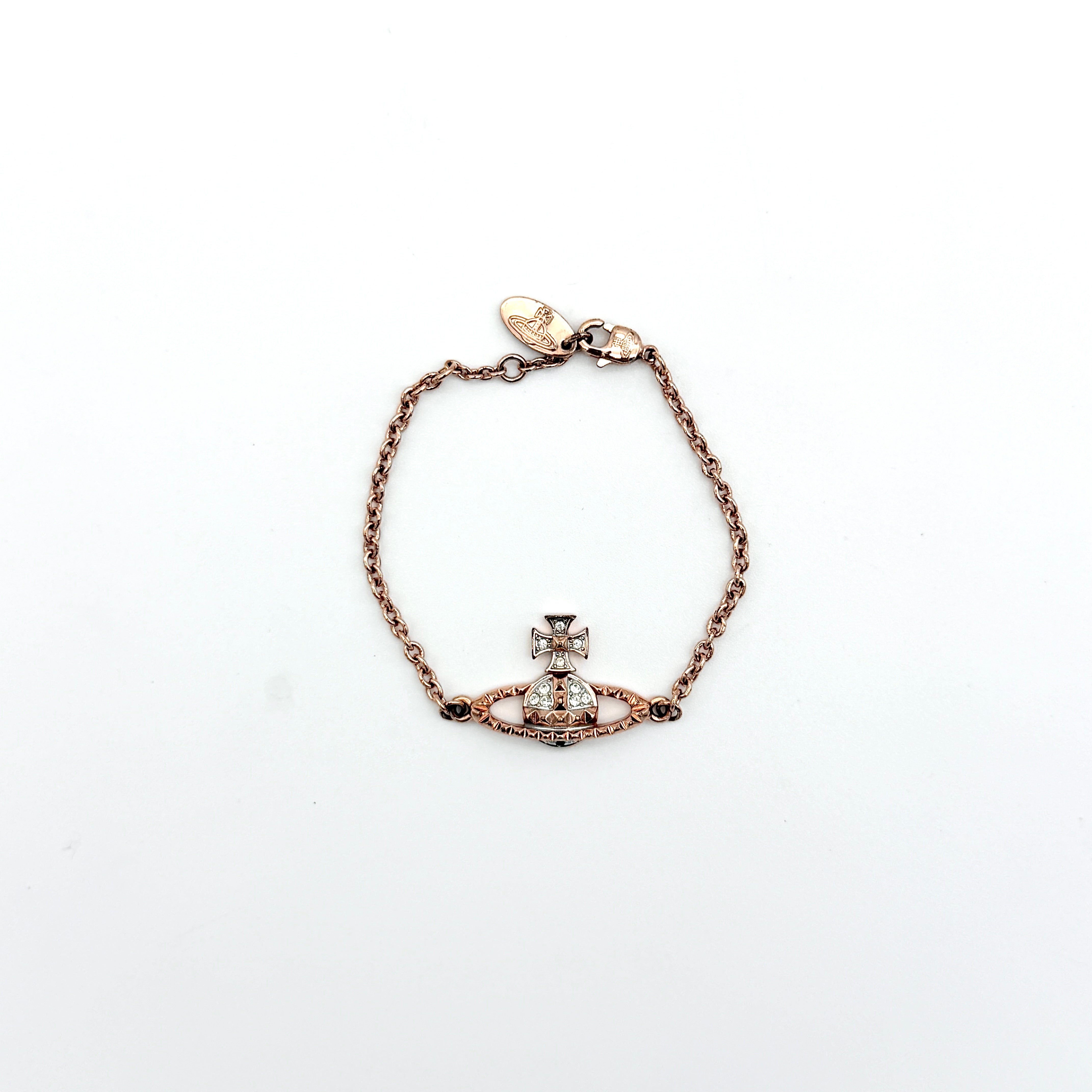 Vivienne Westwood 3D Orb rhinestone bracelet in rose gold with crystal accents and a fine chain.