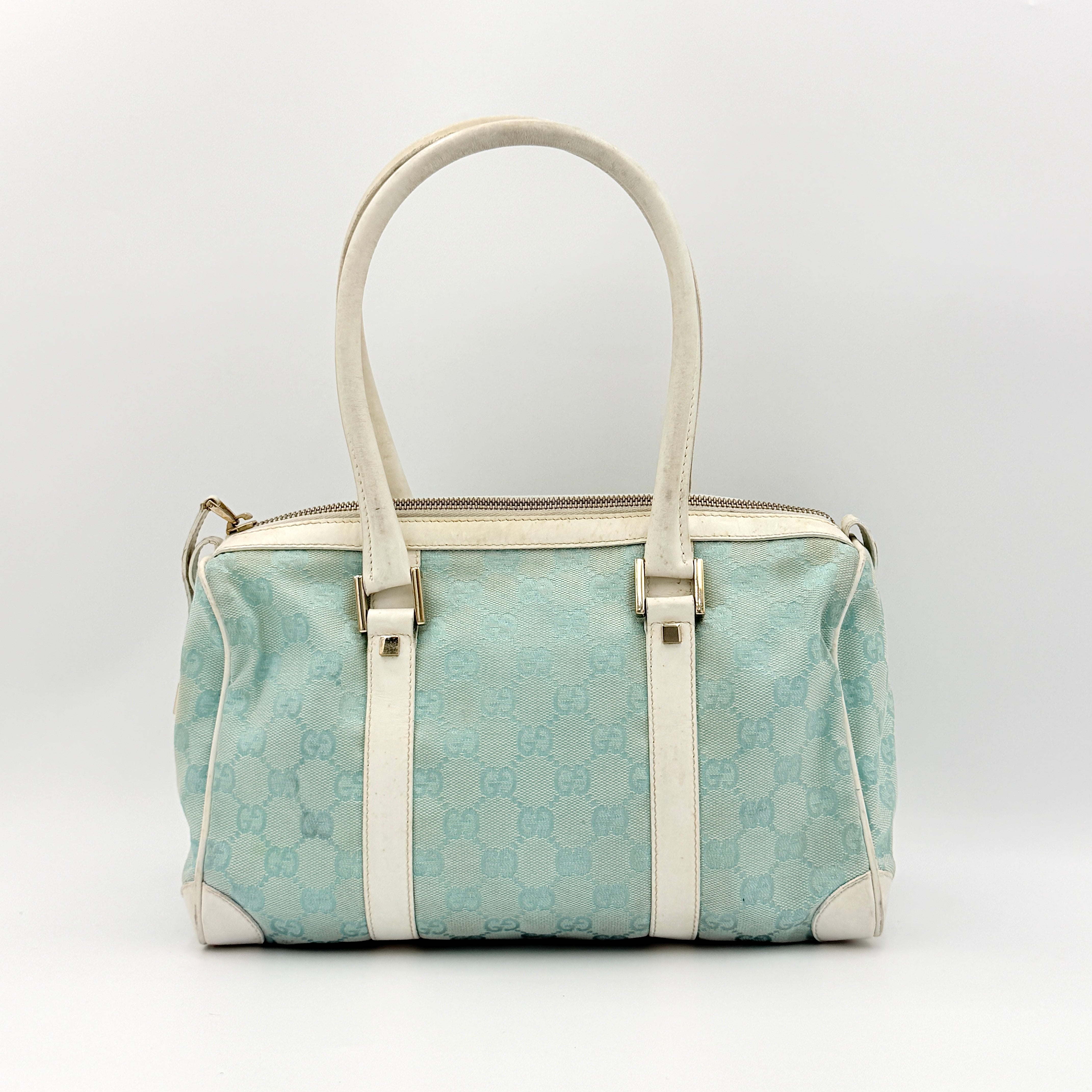 Gucci GG Monogram Boston Shoulder Bag in blue and white canvas with white leather trim, structured silhouette and double top handles.