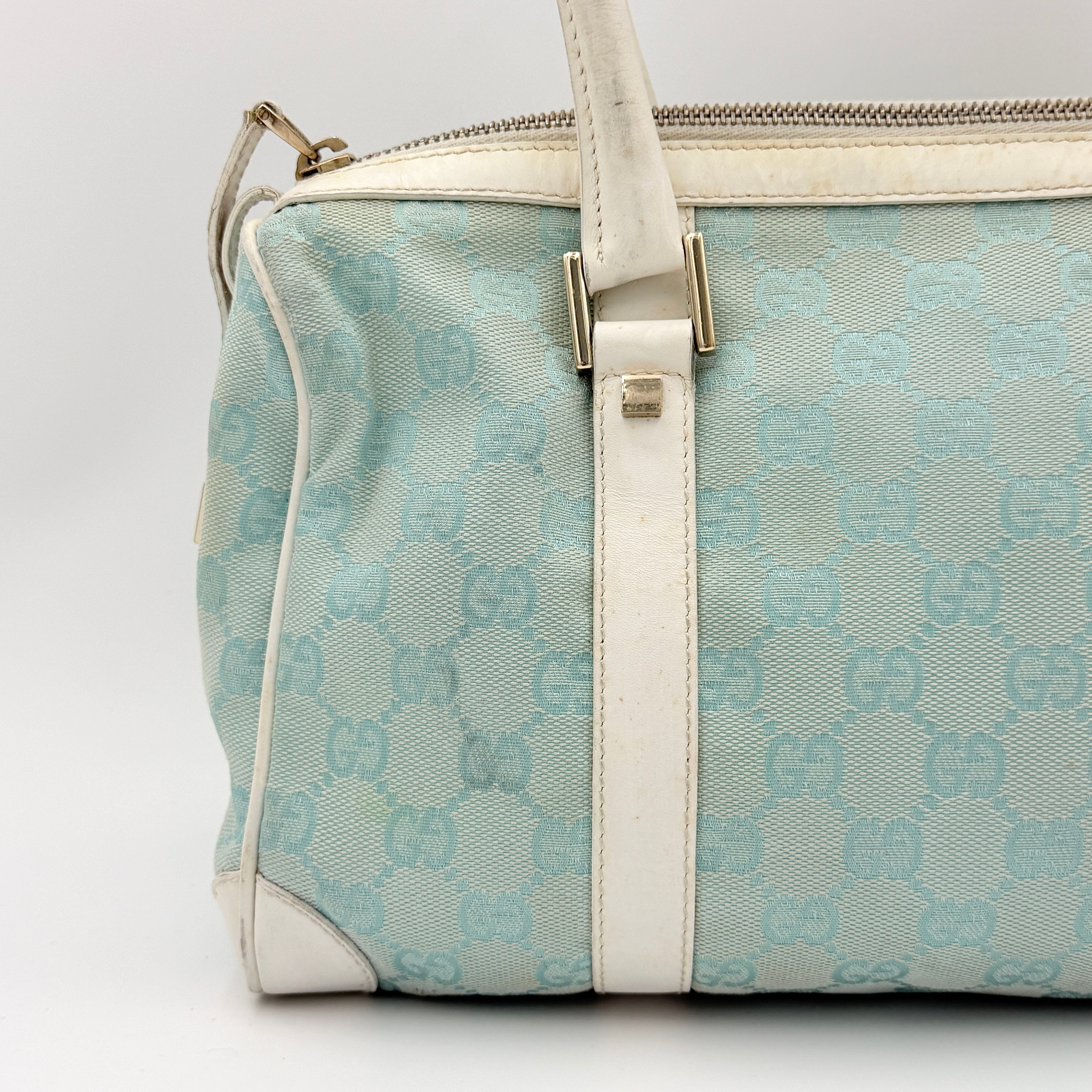 Gucci GG Monogram Boston Shoulder Bag in blue and white canvas with white leather trim, structured silhouette and double top handles.