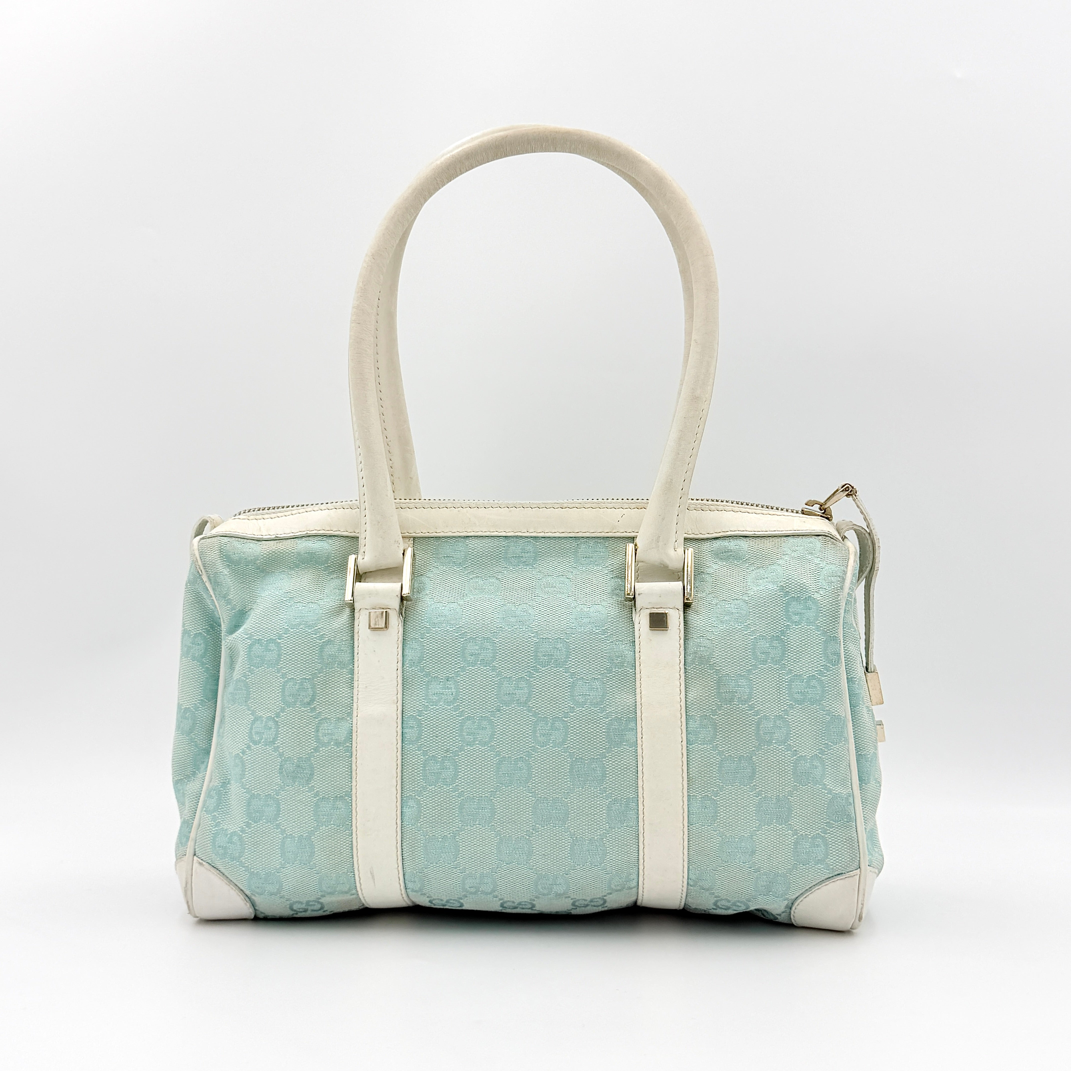 Gucci GG Monogram Boston Shoulder Bag in blue and white canvas with white leather trim, structured silhouette and double top handles.