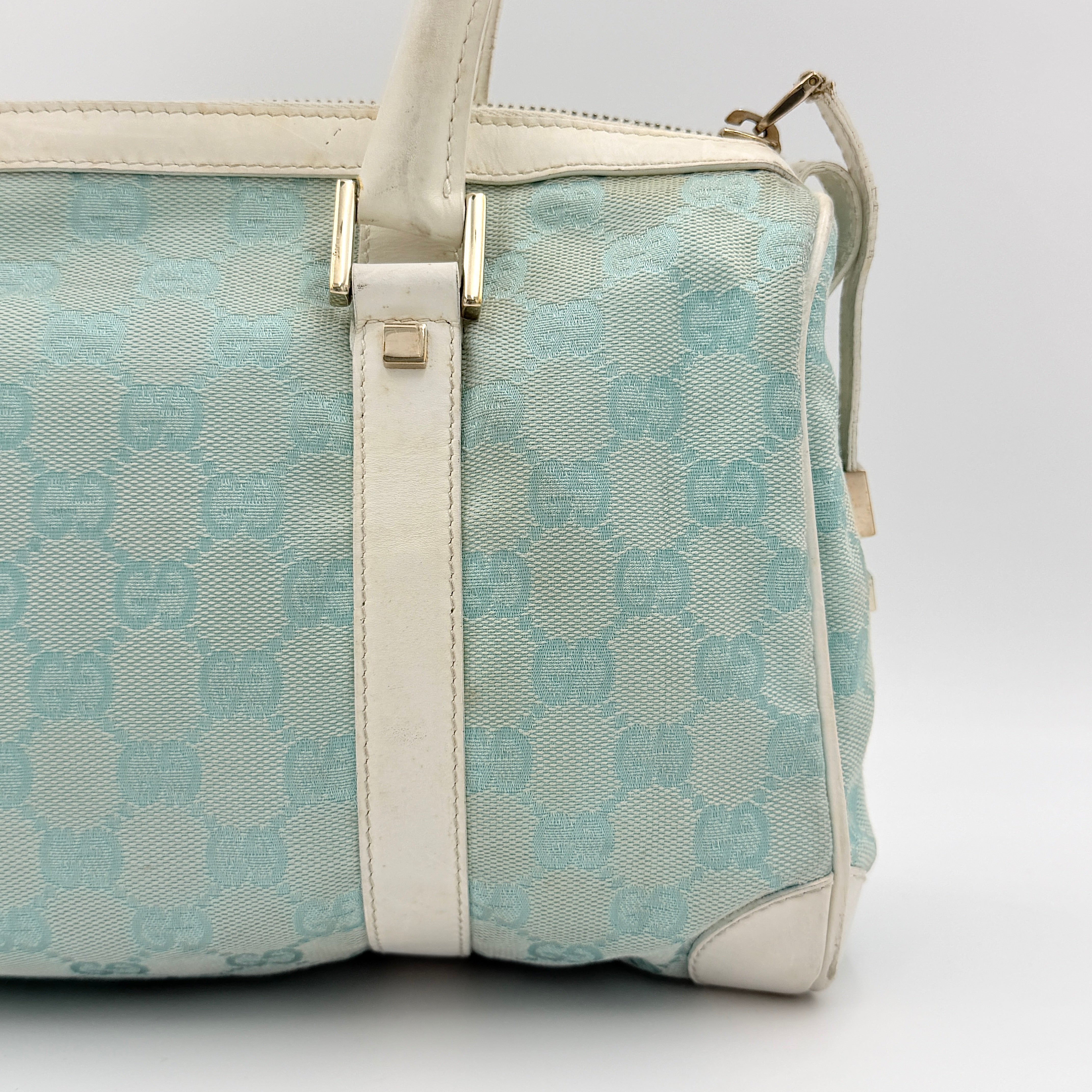 Gucci GG Monogram Boston Shoulder Bag in blue and white canvas with white leather trim, structured silhouette and double top handles.