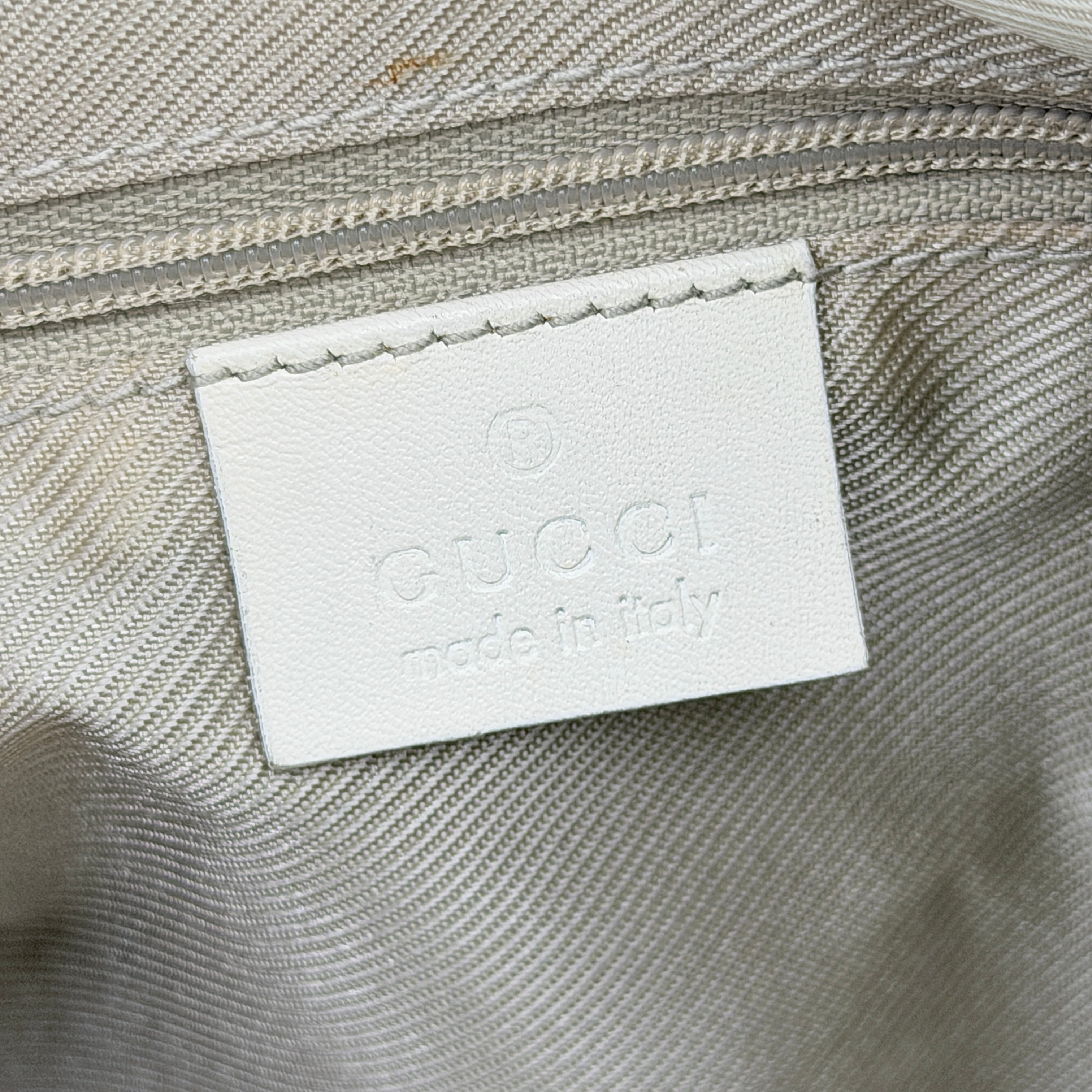 Gucci GG Monogram Boston Shoulder Bag in blue and white canvas with white leather trim, structured silhouette and double top handles.