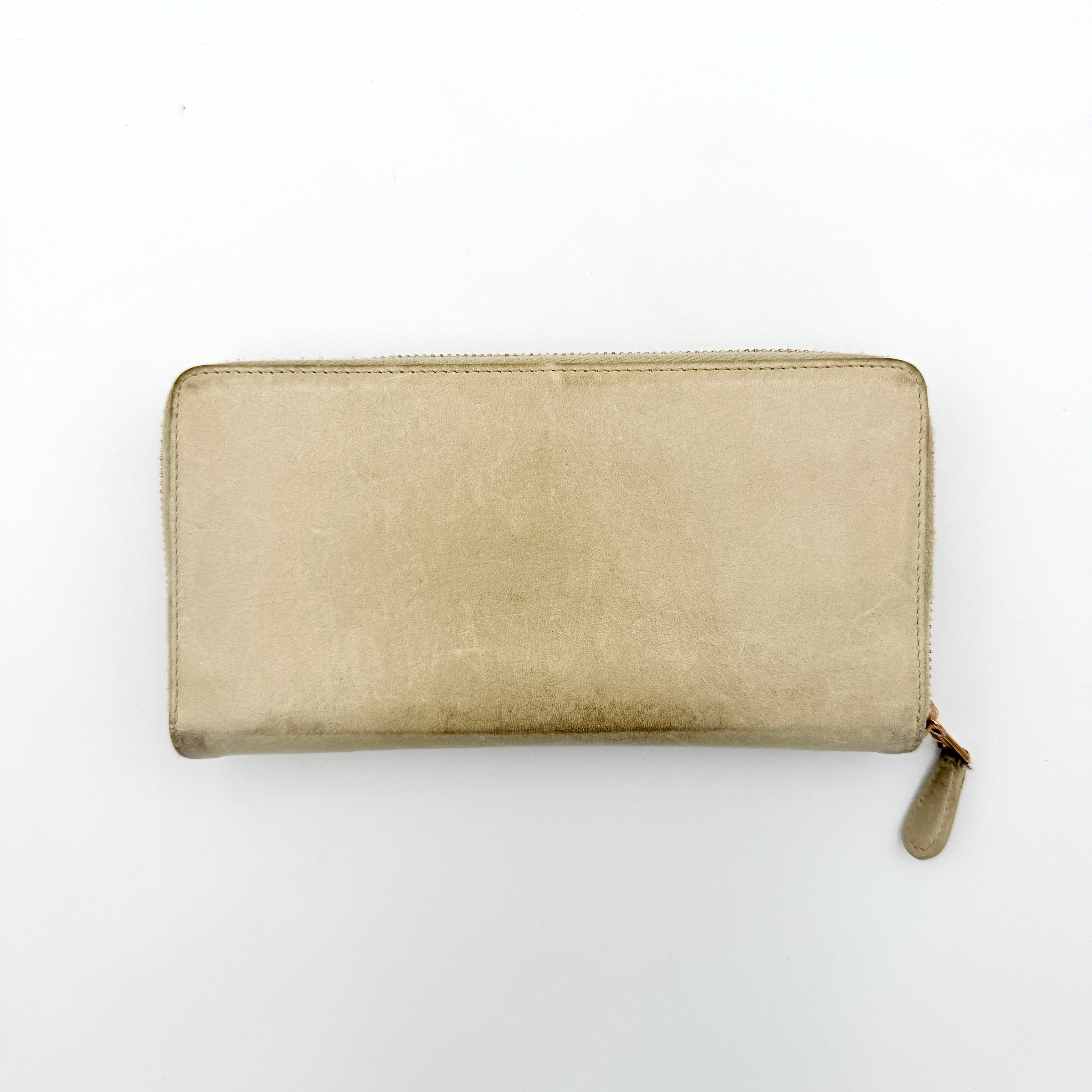 Balenciaga Motorcycle Studded Long Wallet in beige leather with signature studs and front zip pocket, displayed against a clean background.