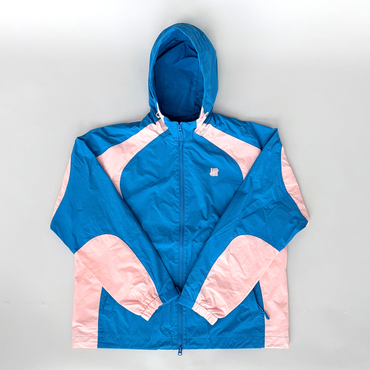 (L) Undefeated Lightweight Hooded Windbreaker Jacket Blue/Pink