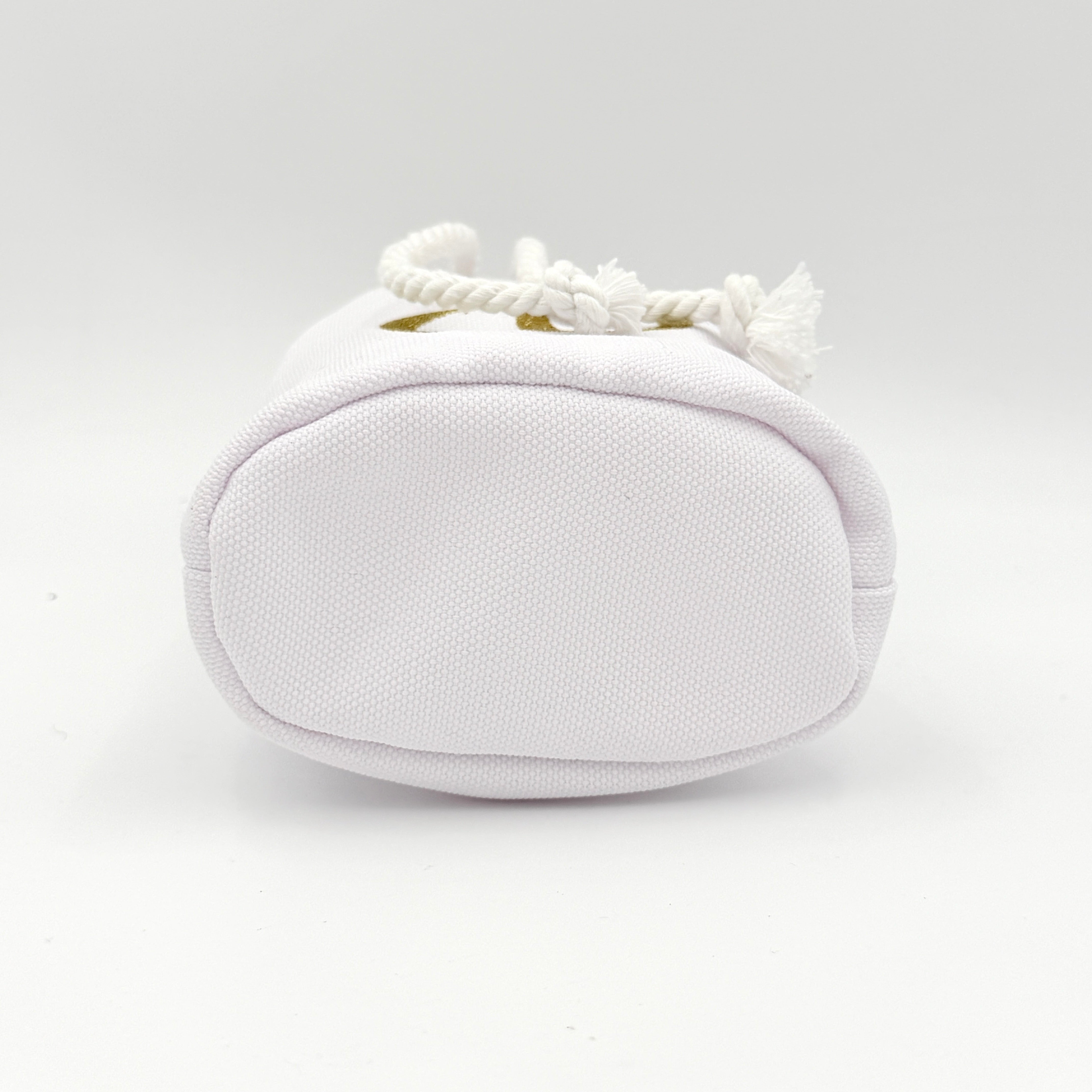 A structured white Dior drawstring pouch featuring a gold embroidered CD logo and white rope closure with gold-tone eyelets.