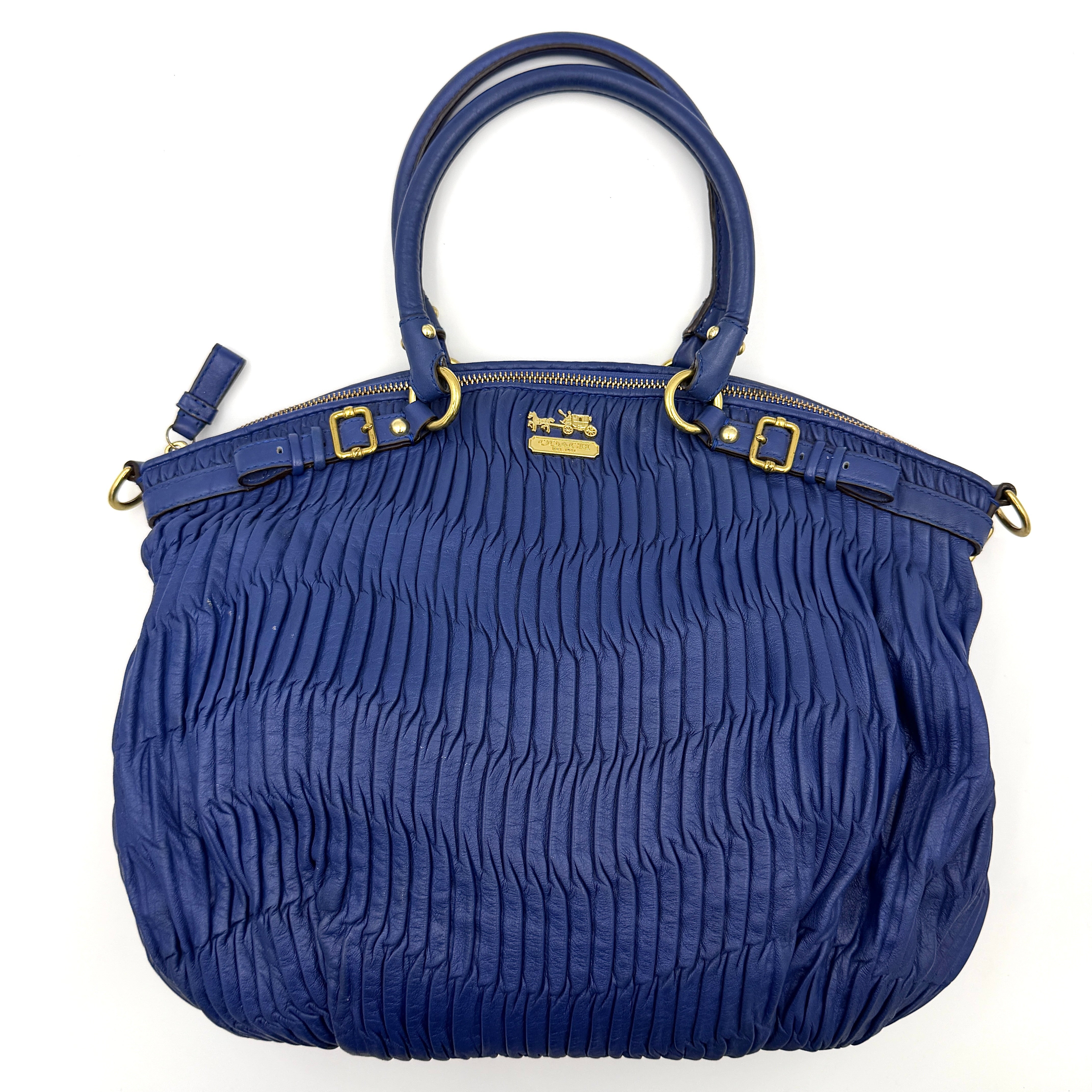 Coach Madison Shoulder Bag in gathered blue leather with gold-tone hardware and removable shoulder strap displayed against a white backdrop.