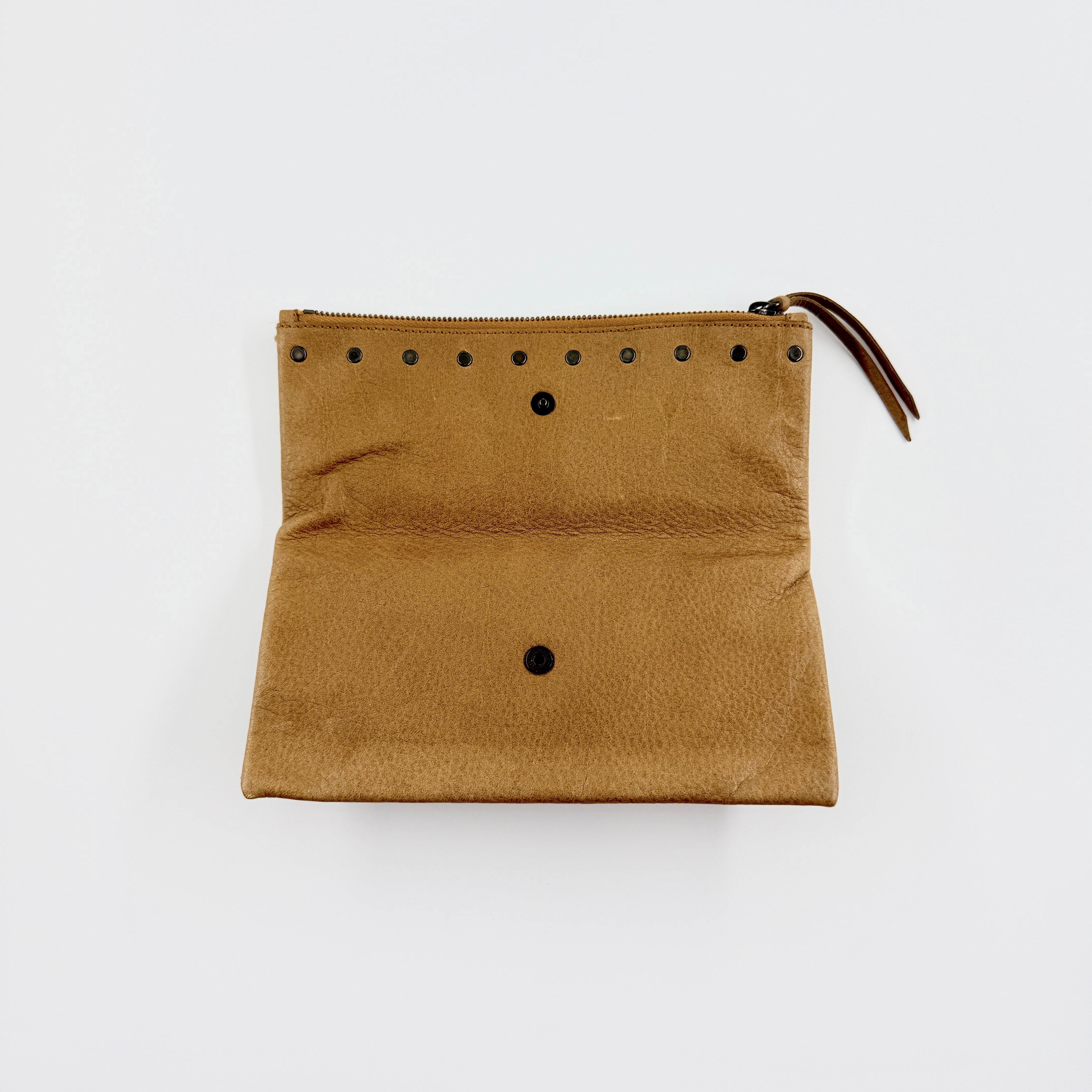 Miu Miu brown textured leather foldover pouch with matte black studs, zip closure, and slim silhouette.