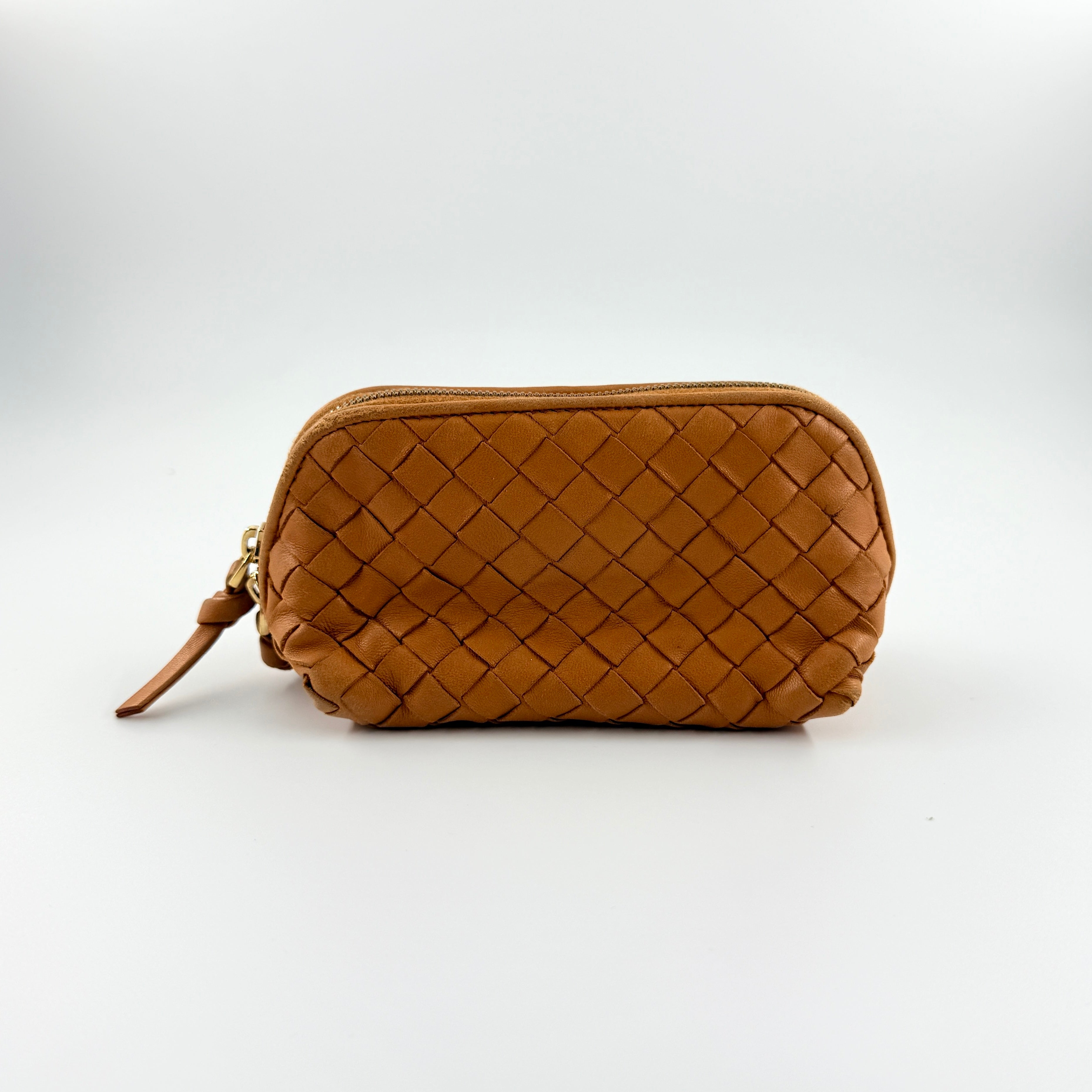 A Bottega Veneta brown Intrecciato leather pouch with gold zip and woven texture, displayed against a clean, minimal background.
