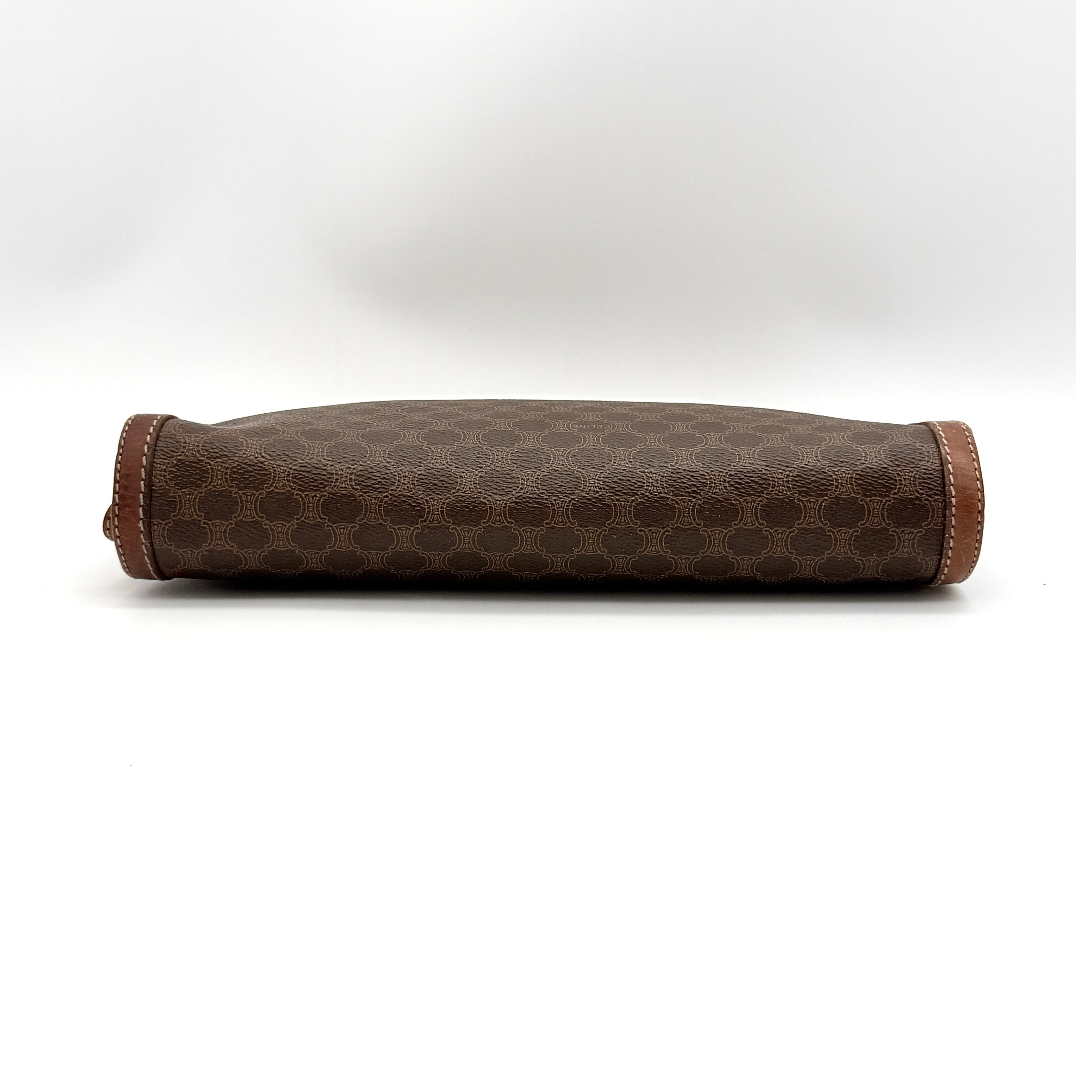 Front view of the Celine Triomphe Macadam clutch bag in brown canvas with tan leather trim and zip pocket.